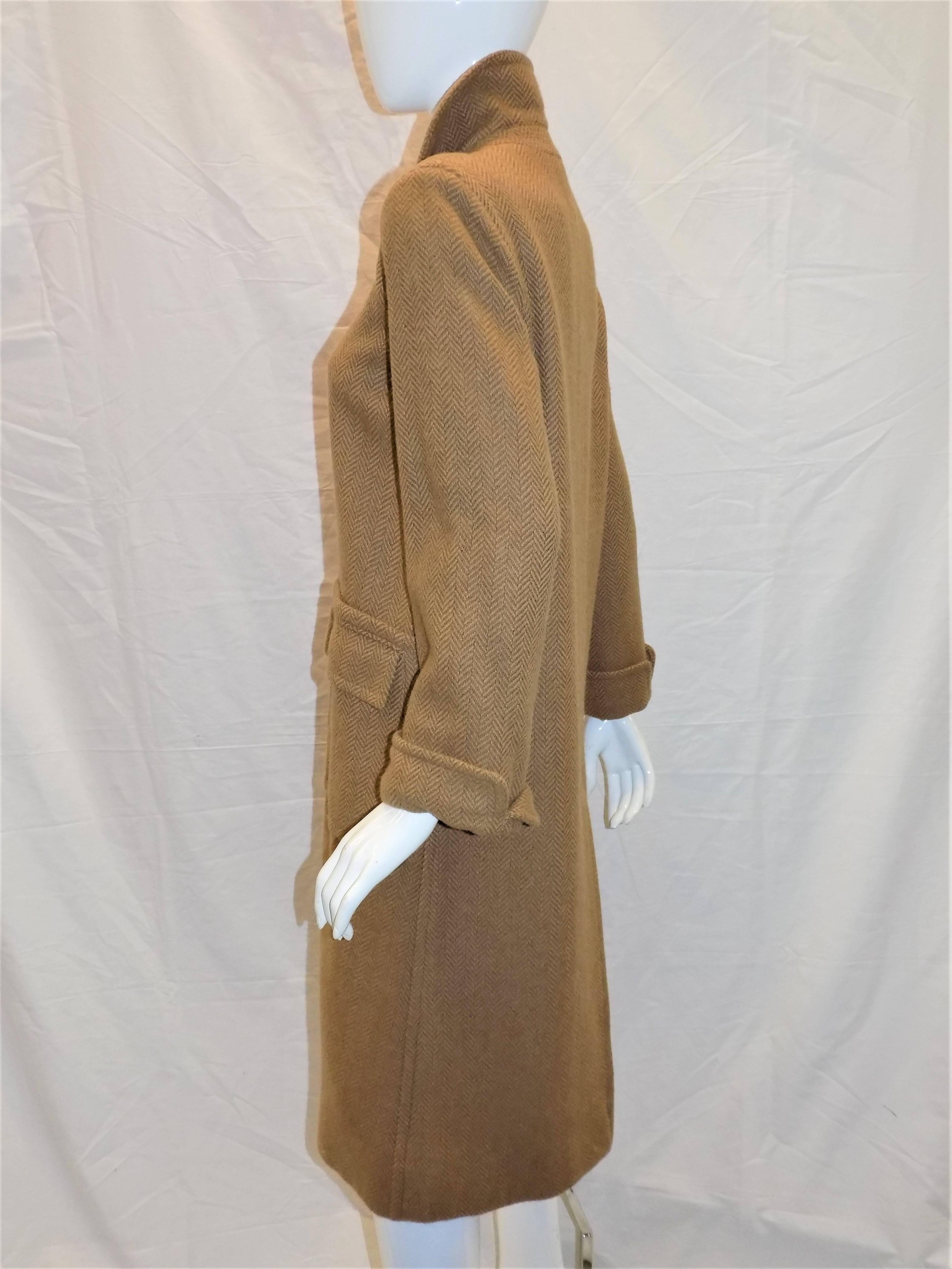 Beautiful classic YSL Yves Saint Laurent Rive Gauche Vintage camel color  haring bone coat. Two front patch flap pockets. Single front buttons. Fully lined. Pristine condition. Size tag is missing. Please refer to measurements. I believe it is sz 6.