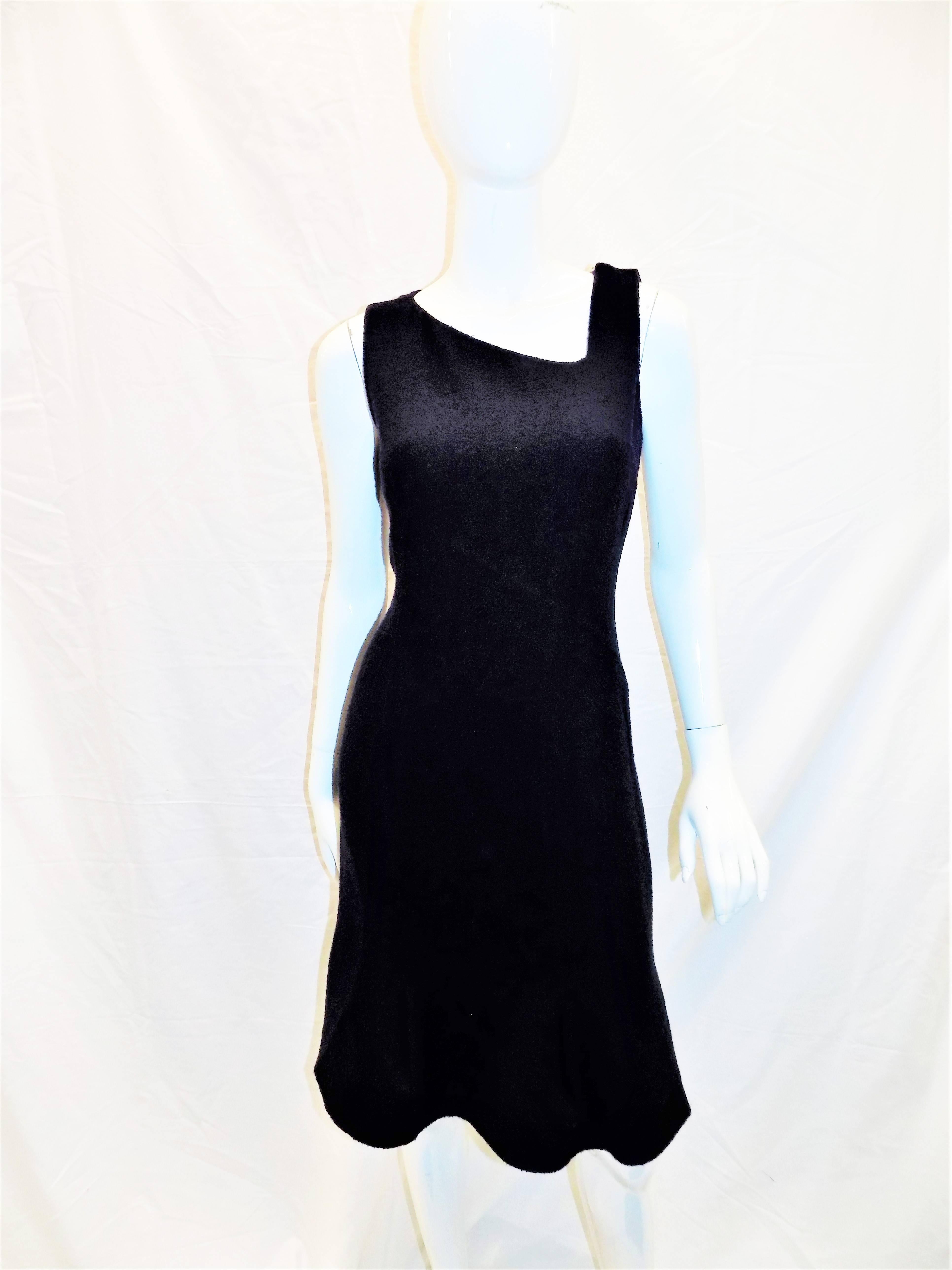 Light wool buckle in midnight blue . Hourglass silhouette dress with asymmetrical neckline  and flare bottom. Cropped open front jacket/ bolero style with twp patch front pockets. Very elegant  and versatile ensemble. Wearable from day to evening.