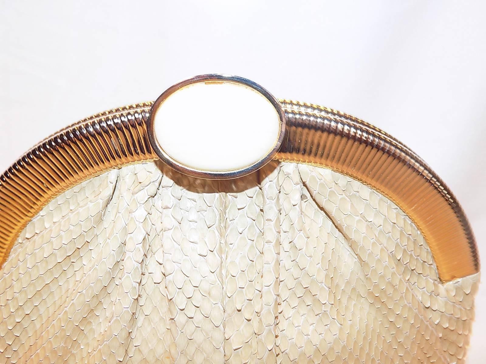 Beige Snake Skin Frame Handbag or Clutch with large oval  Stone Clasp!  Easily converts to a clutch.  Bag is neutral color and so perfect for any dress and any occasion. Excellent size to fit your phone and all you need for the evening. Mirror and