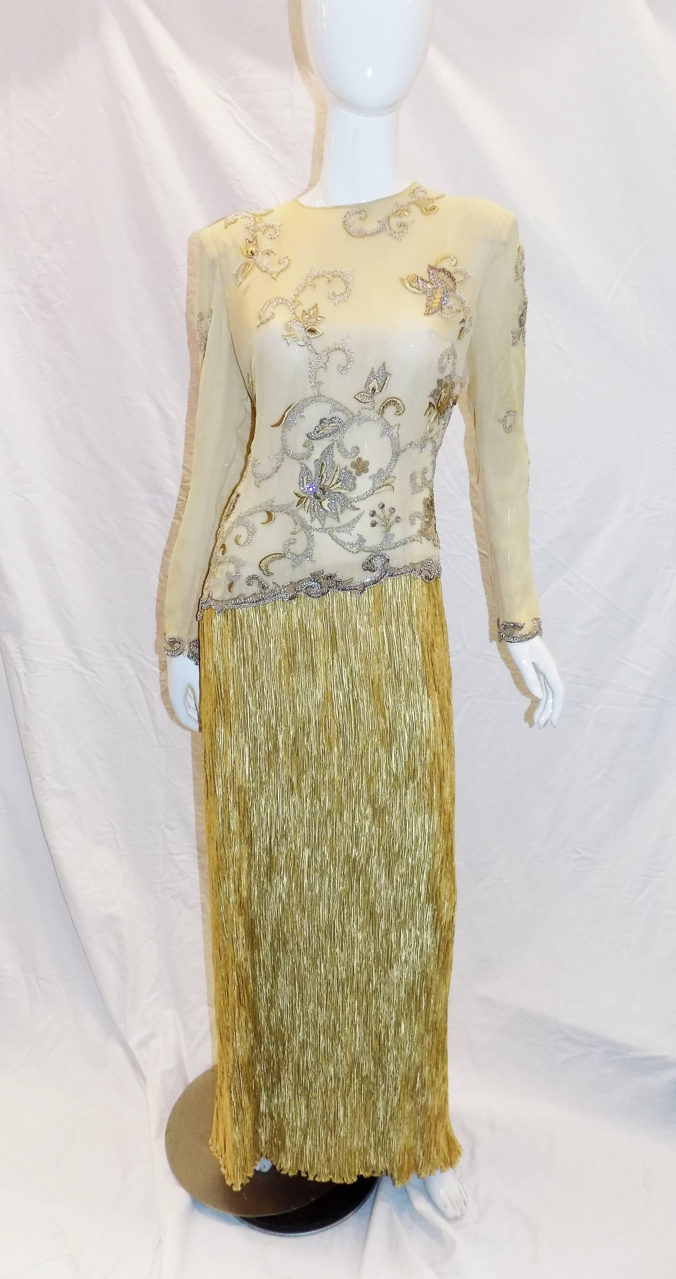 Fabulous  Mary McFadden   couture silk gown with  embroidered top ,  beading and sequins. It is  stunning 1980's Gold  evening masterpiece that takes you back to another time. The fabulous bead and sequin work throughout the gown, coupled with the