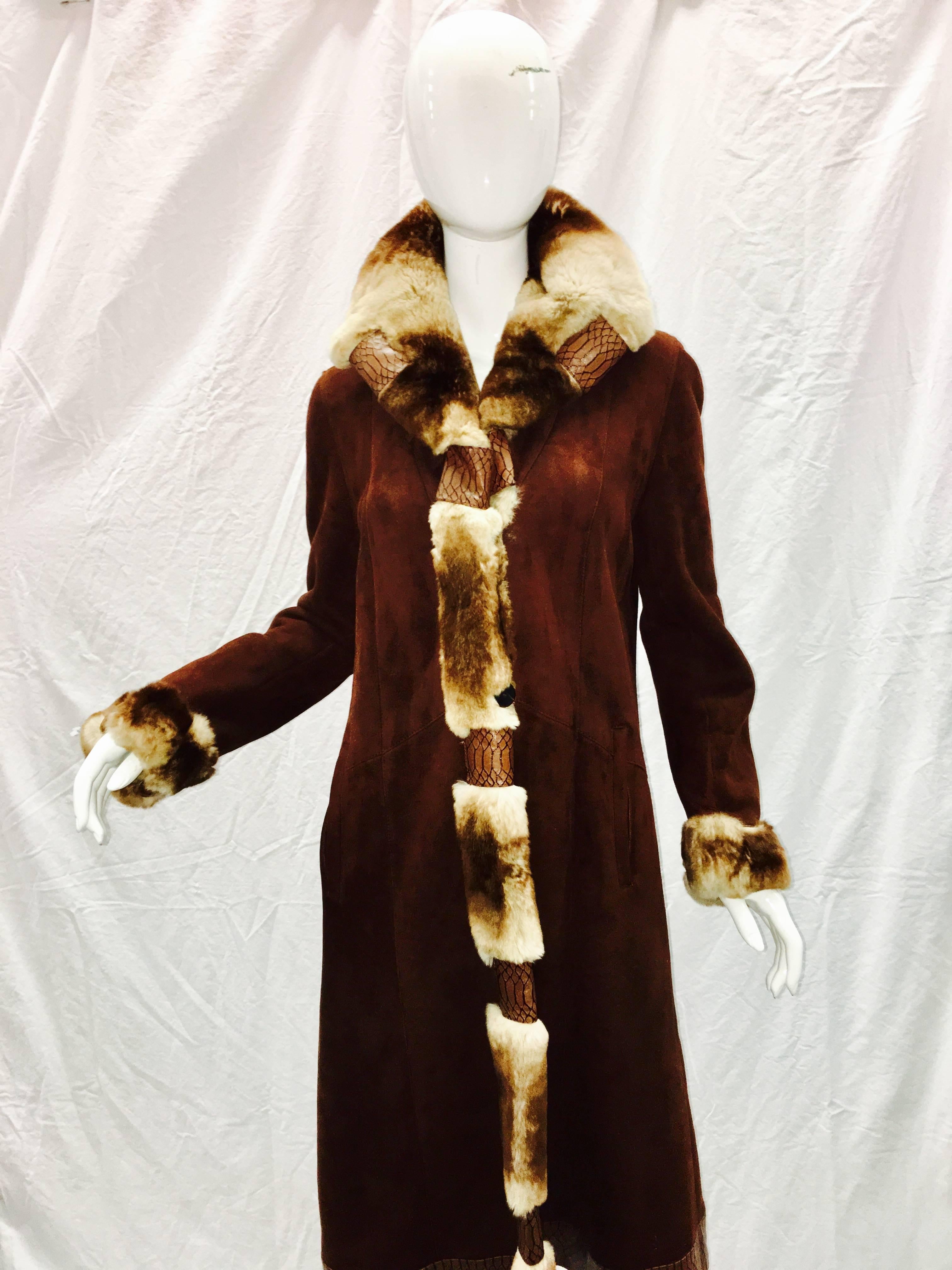  Custom made in Italy Stunning light weight brown Genuine  shearling trimmed in soft Rex rabbit and python embossed leather. Very chic and modern. Size 6/ 8 bust 38" sleeves 26" length 48".  Paid over $2800 Pristine condition Like