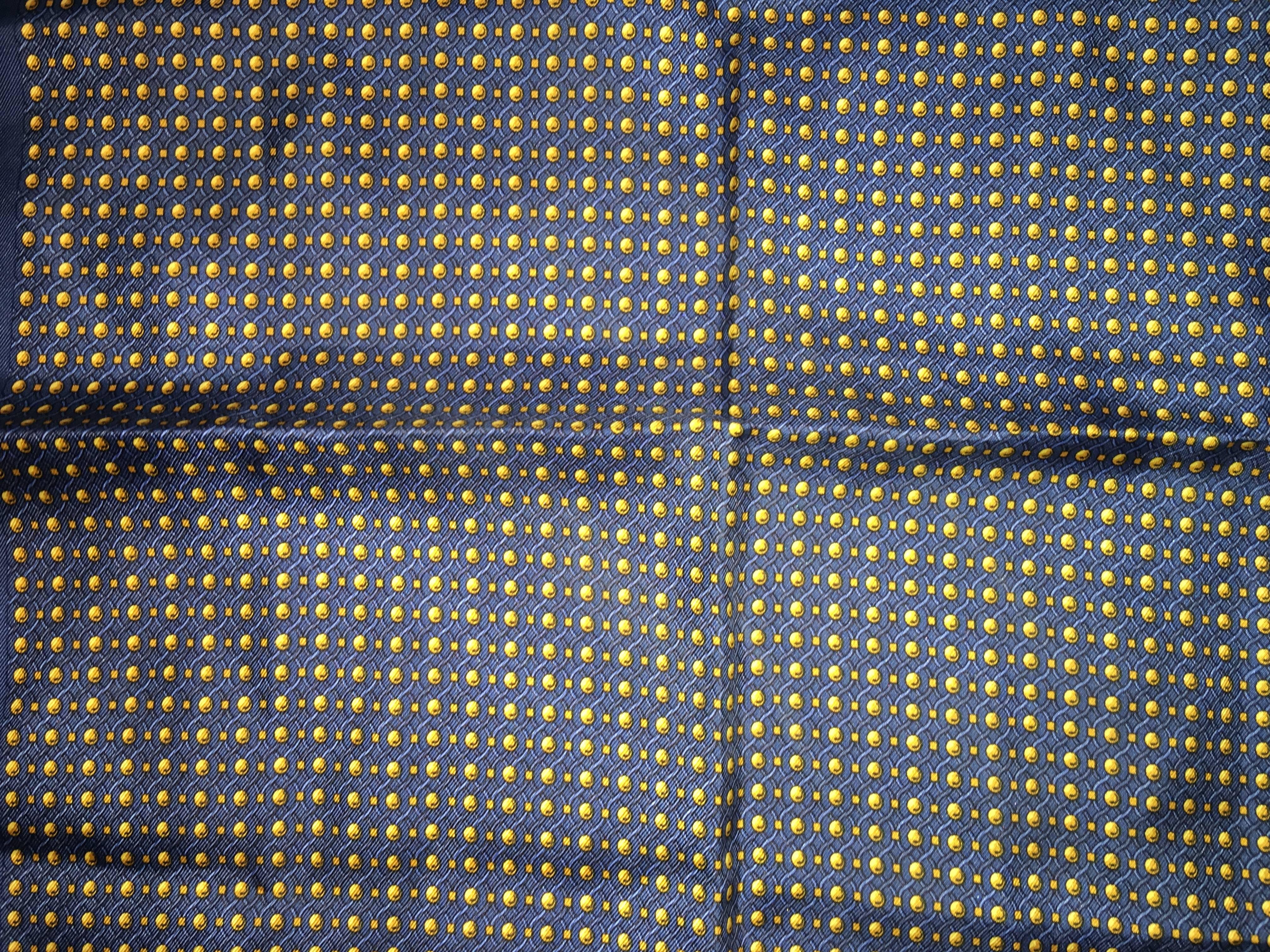 Hermes navy blue  silk pocket square with yellow golf balls  motif throughout and hand rolled edges. Rare Vintage print. New never used. 16