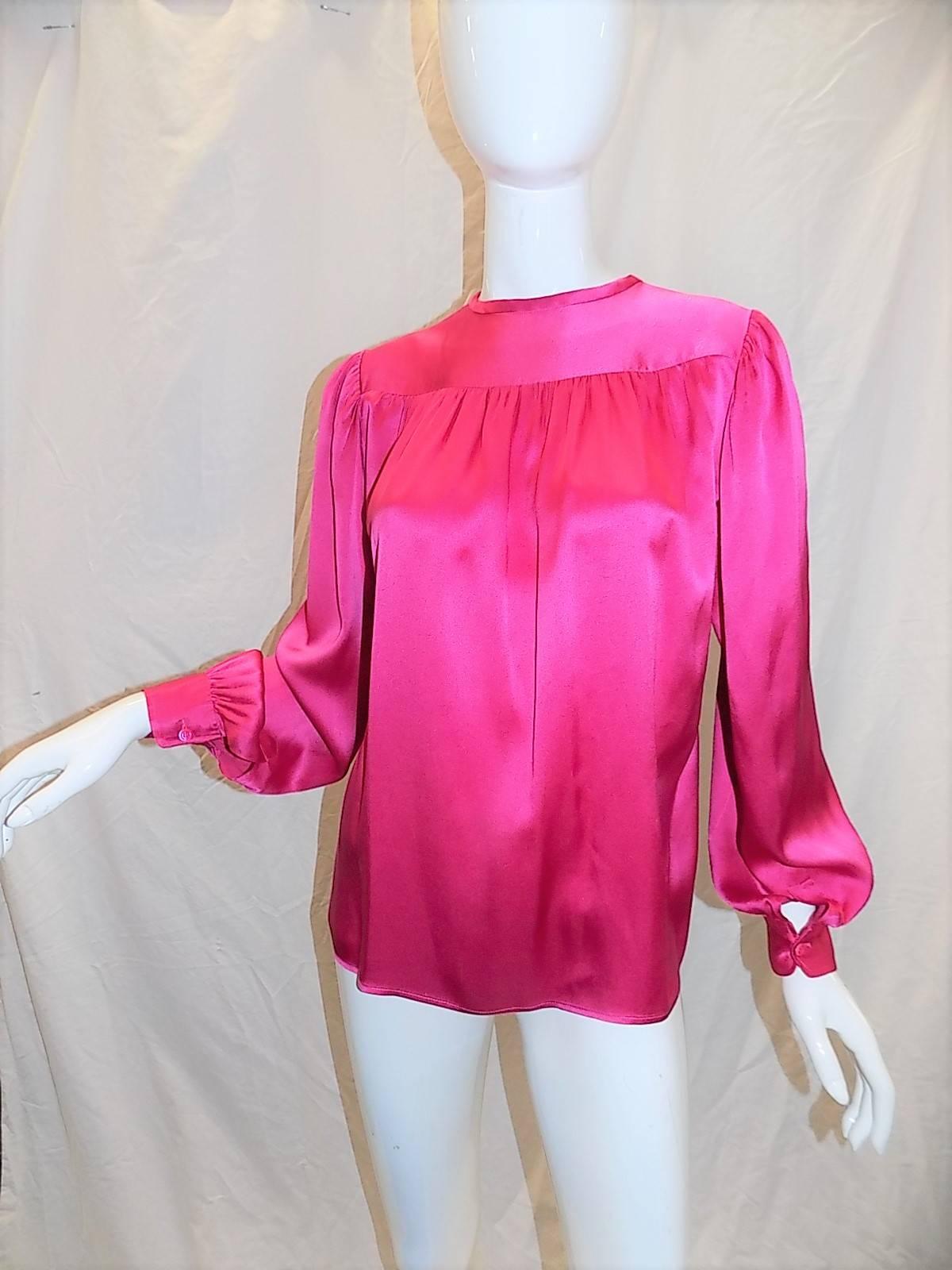 Signature pink color Yves Saint Laurent silk blouse. Mint condition. Size 36.
Bust 42