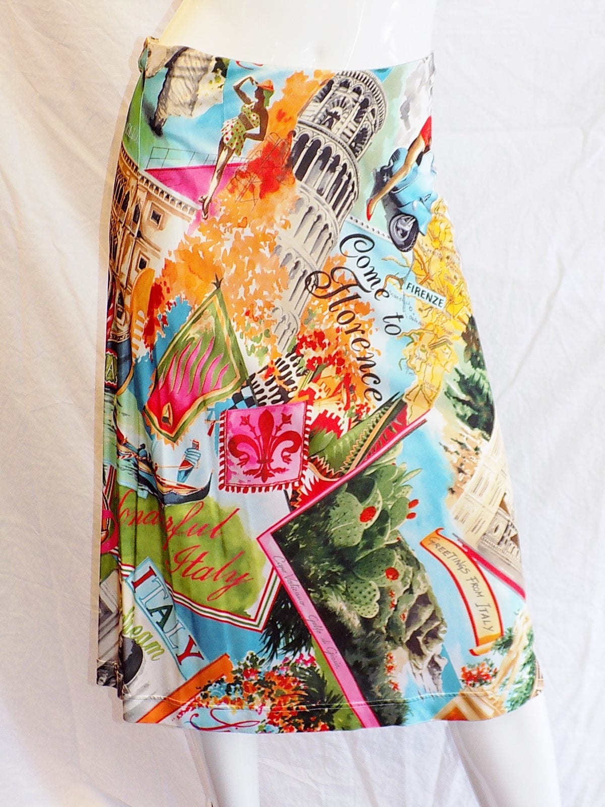 Playful and super cute  Dolce and Gabanna top and skirt for spring/ summer.  features Italian postcard images /souvenirs. Silky poly jersey. pristine condition. Size 40.
A line skirt with zippered waistline. 
Waist 28