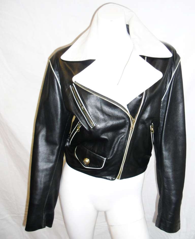 Stunning black and white zipperered Moschino  biker  leather jacket. Excellent condition. size 4-6