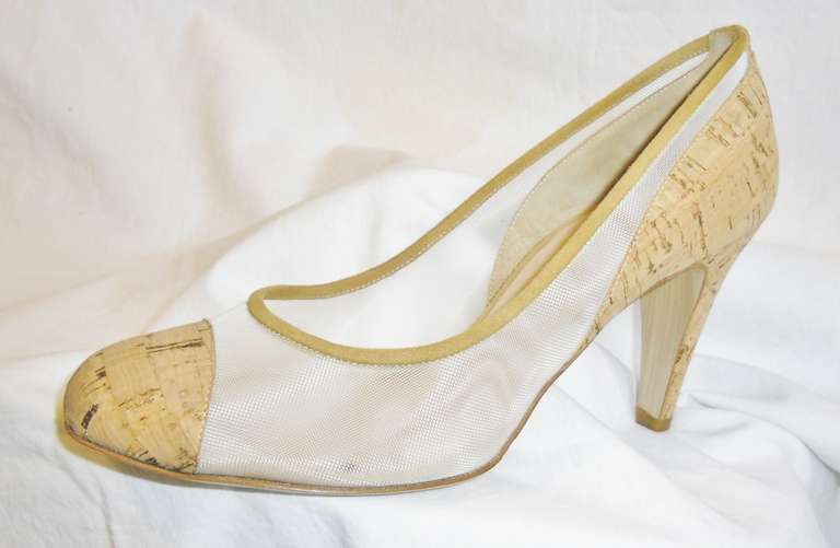 New In Box fabulous summer Chanel shoes. Clear mesh with cork and nude suede trim for comfort. Round toe. 3.5 Inch heel with  small gold tone cc logo
Shipped in original box