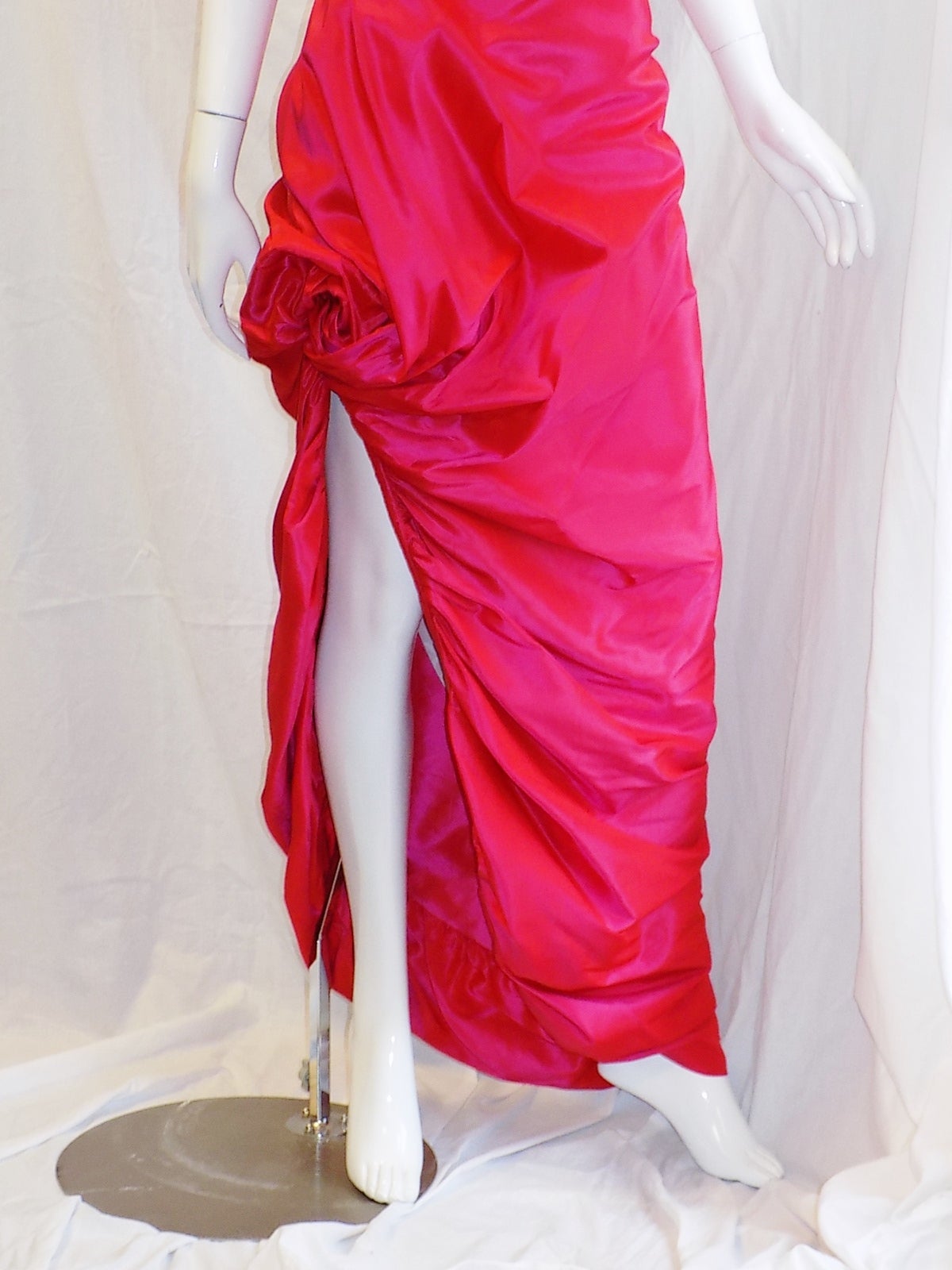 Absolutely spectacular! Silk Taffeta gown by Vivienne Westwood. High Fashion all the way. Signature corset inside with irregular  draping over. 
Pristine condition. Size small 2- 4