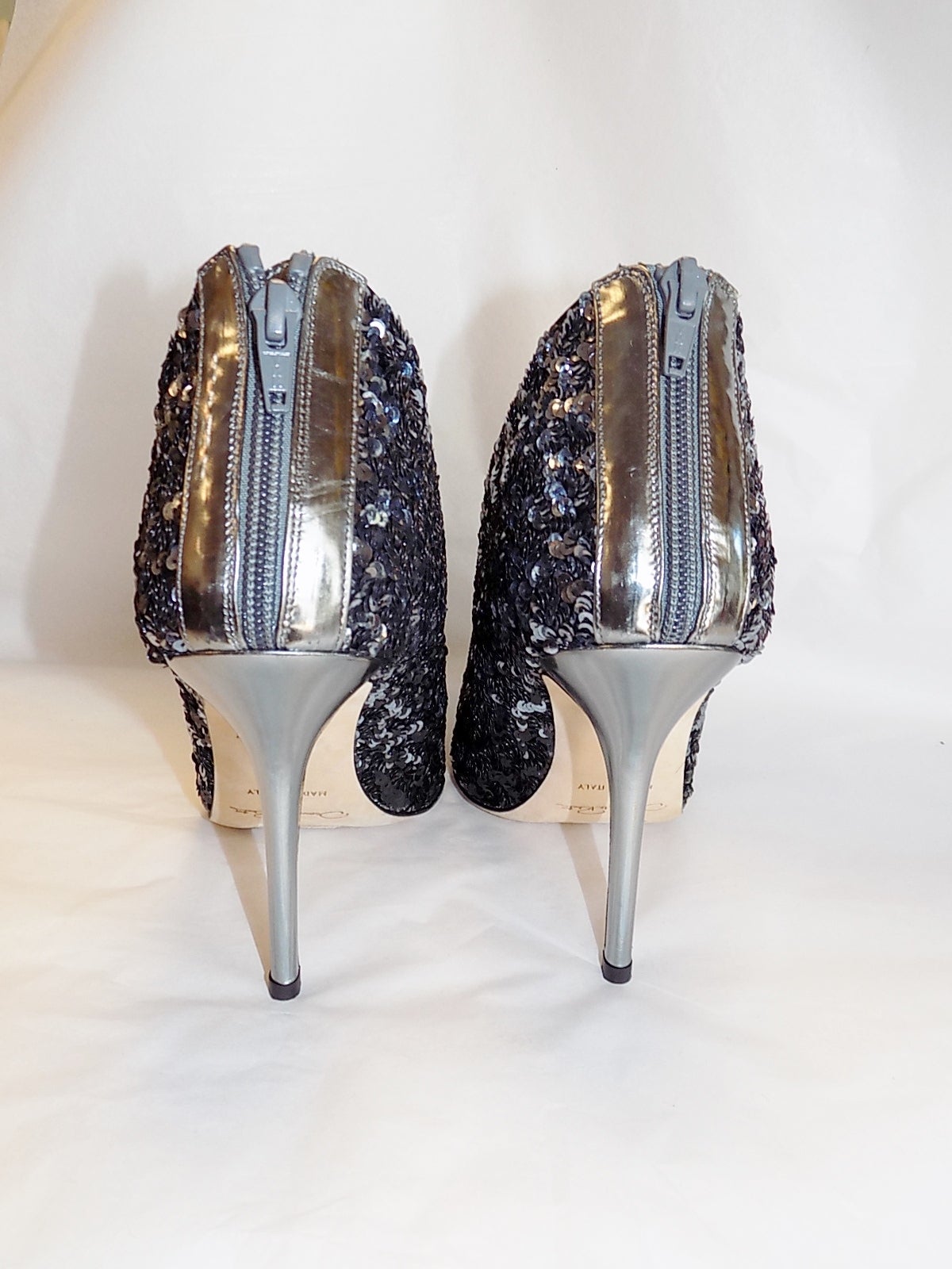 2015 SOLD OUT Oscar de la Renta black and silver Eva ankle boots. Heel measures approximately 105mm/ 4 inches. Black satin. Silver sequins, pointed toe. Zip-fastening back. Fits true to size, take your normal size. Italian sizing. Narrow at the toe.