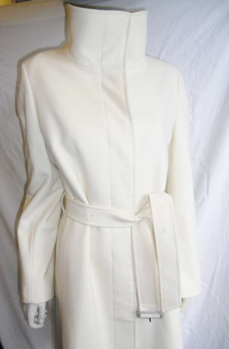 Wearing this amazing winter white coat by Burberry will cause Scandal everywhere you go!!!  Cow neckline , concealed buttons,  belt and oh so elegant line.  Excellent . condition  wool and cashmere blend
Size  italian 44. 
Bust 40