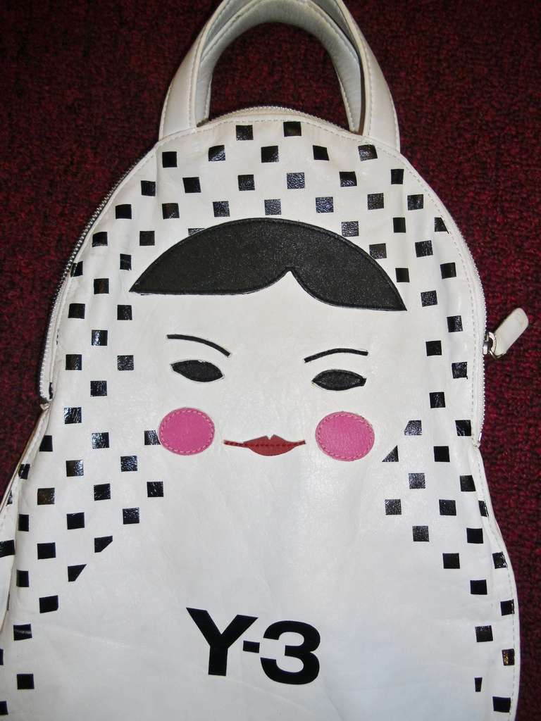 Yohji Yamamoto Russian doll Bag. Collection Y-3 . White supple leather . Cotton lined. Zip top closure. Small double handles. Very cute. .
Bag is 18 inches long  and 11 inches wide, One zip closure pocket and cell phone compartment
Excellent