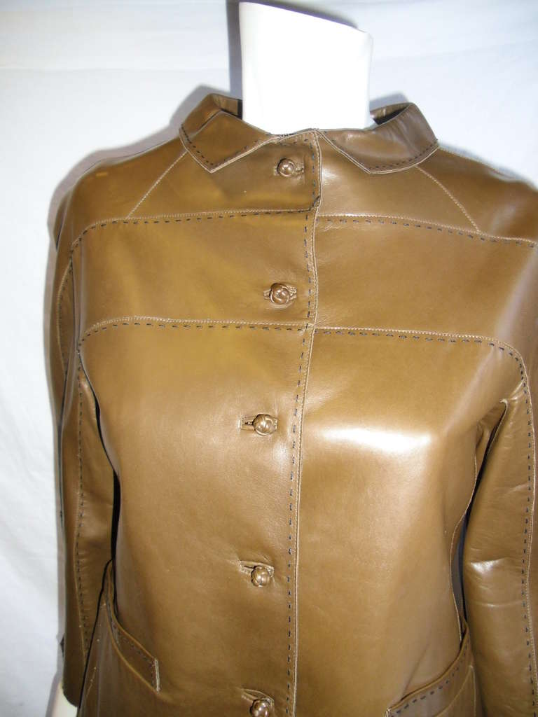 Buttery soft lamb leather in gorgeous rich cognac color. Featuring signature Chado french knots as buttons,  two half back belts  and top hand stitch.Silk lining. Pristine condition . No signs of wear. size 4
Bust 36