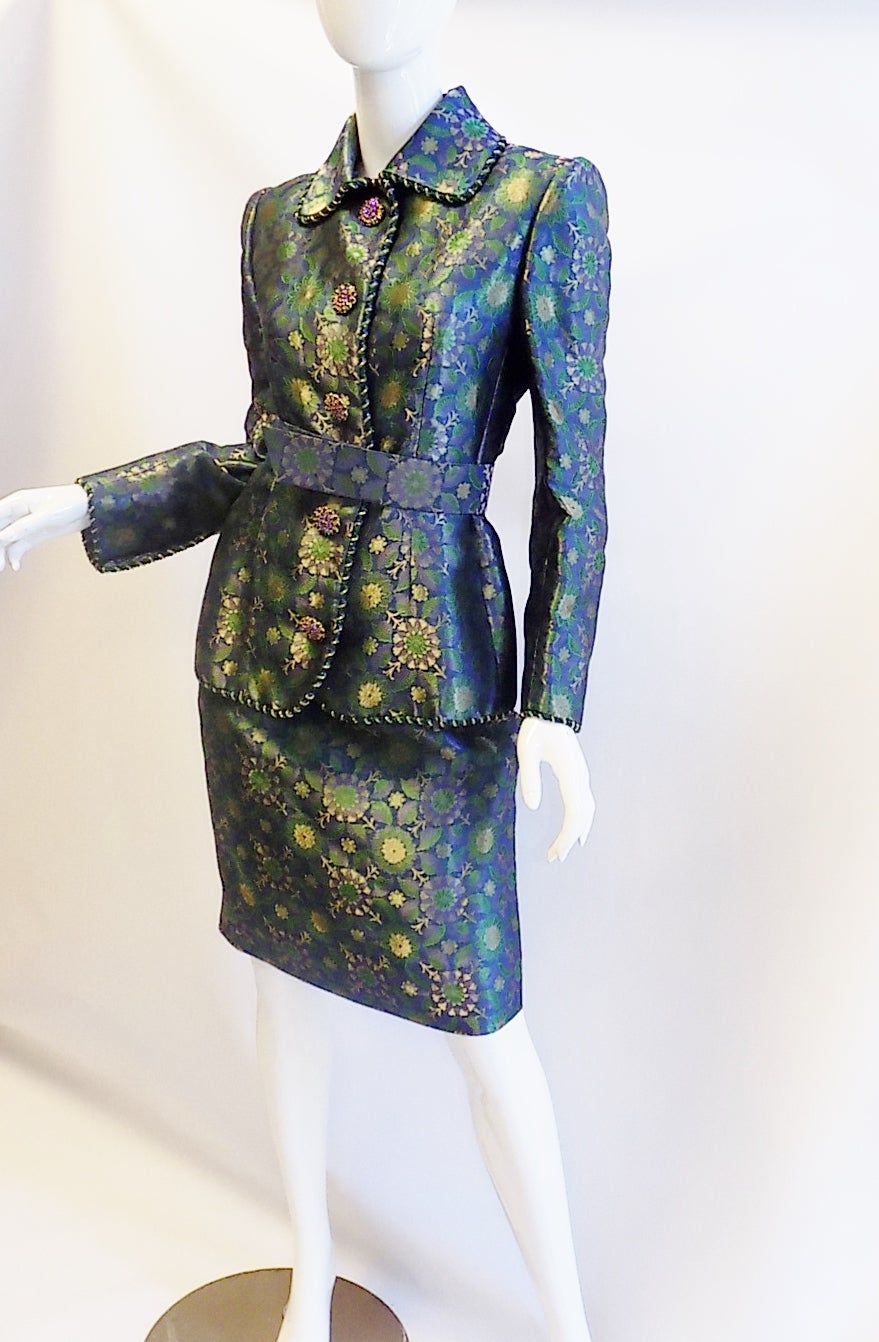 Insanely beautiful golden green metallic  silk brocade skirt suit by House of Givenchy  Couture.  Circa 1990's. Hand beaded twisted trim and gorgeous jeweled large buttons. All silk lined. Tailored to a perfection! Snap front closure. No signs of