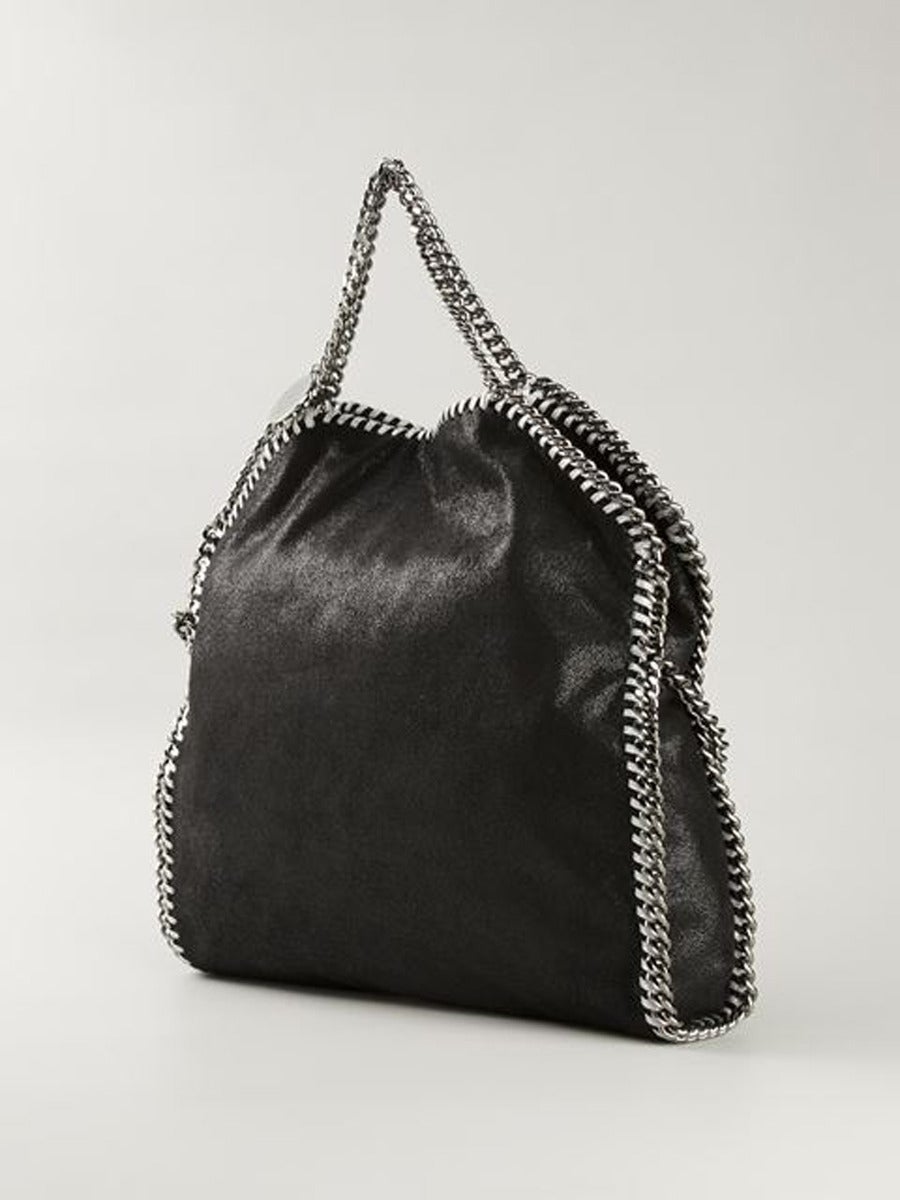 Fold-Over Falabella, Black
The Falabella bag is a Stella McCartney favorite for its edgy design and vegan-friendly construction. Whether you carry it by the top handles, the shoulder strap, or fold it over and tuck it underneath your arm like a