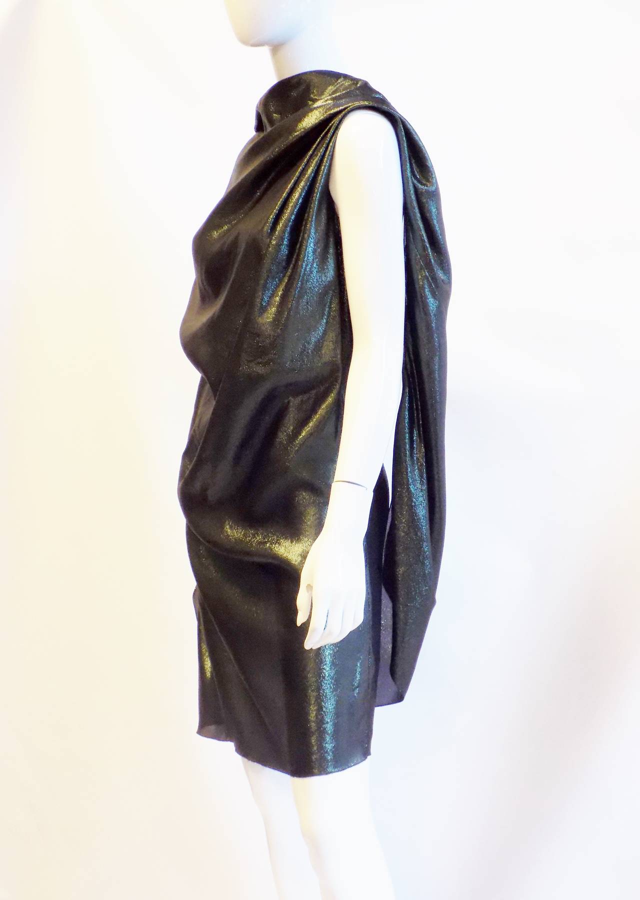 Lanvin dress in washed metallic fabric.Collection winter 2010 . Size wide zipper.     Draped shift silhouette.    Hem hits above the knee.    Silk/polyester.
    Made in France. Size 4
Pristine condition

Lanvin is the oldest French house of