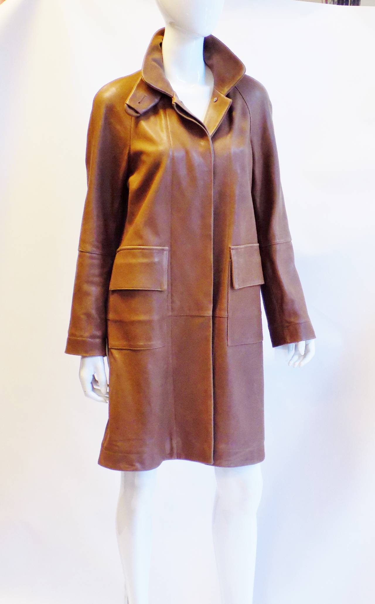 Never worn stunning Marni Lamb Leather Coat in Camel color. Concealed  front button closure. large front patch  pockets . . Great design. Retailed about $6K
Size 42
Bust 40