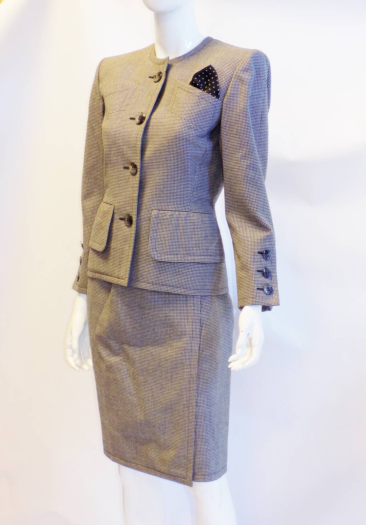 Beautiful, sexy stylish and very powerful looking   YSL Haute Couture   wool gabardine skirt suit. Black and white  micro  houndstooth  glass buttons and  polca-dot hankie . Front wrap  strait skirt. Perfectly tailored jacket with amazing details. 