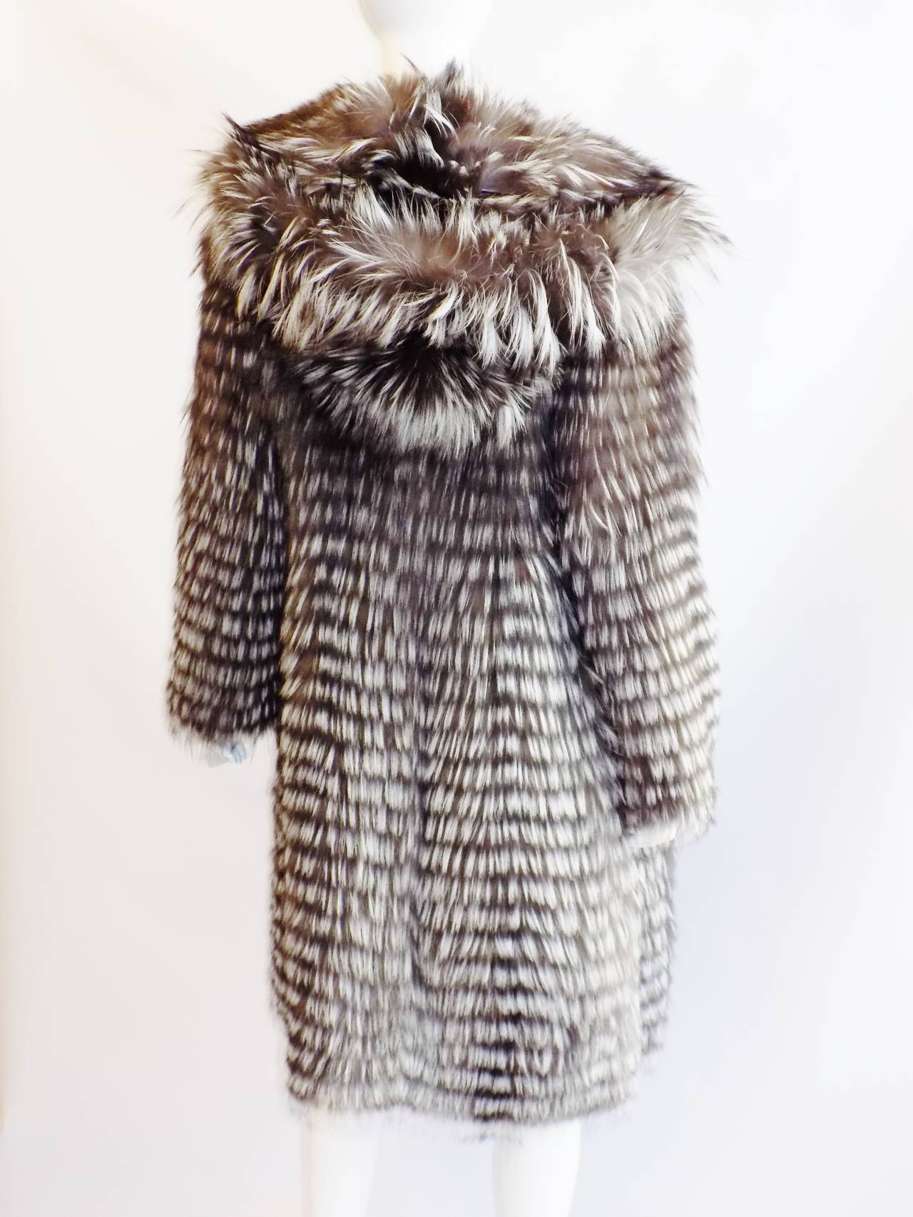 New Never worn Carmen Marc Valvo Couture Feathered Silver fox  Hooded  Fur coat . Lite as a 