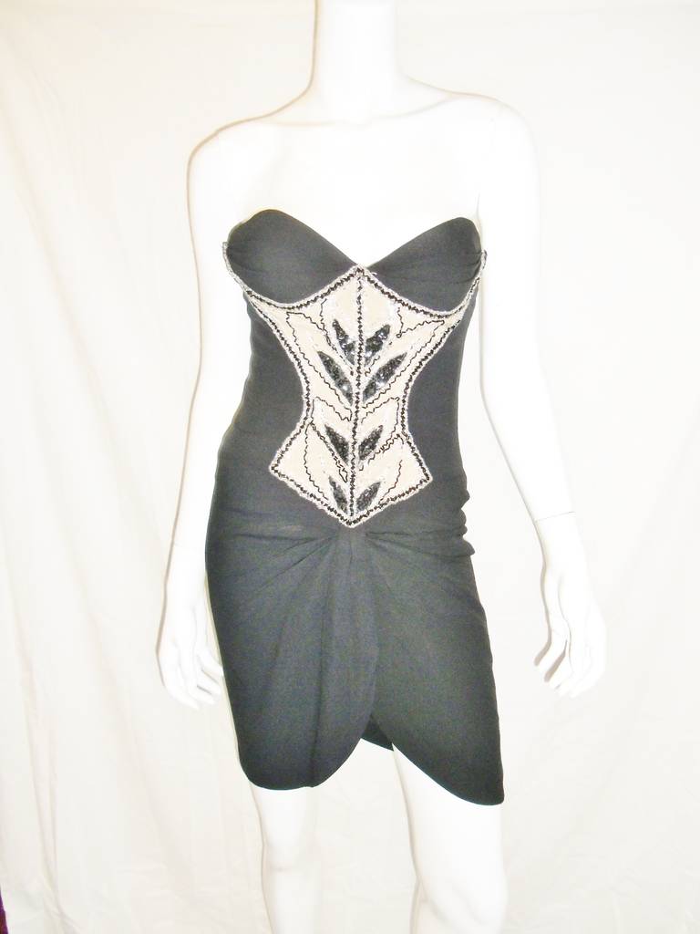 Designed at the heat of his career  in 1980 stunning  iconic  Bob Mackie  vintage  beaded corset cocktail  dress.   Corset bodice with front completely hand beaded . Skirt part tulip style pulled and gathered in the middle. In excellent condition. 