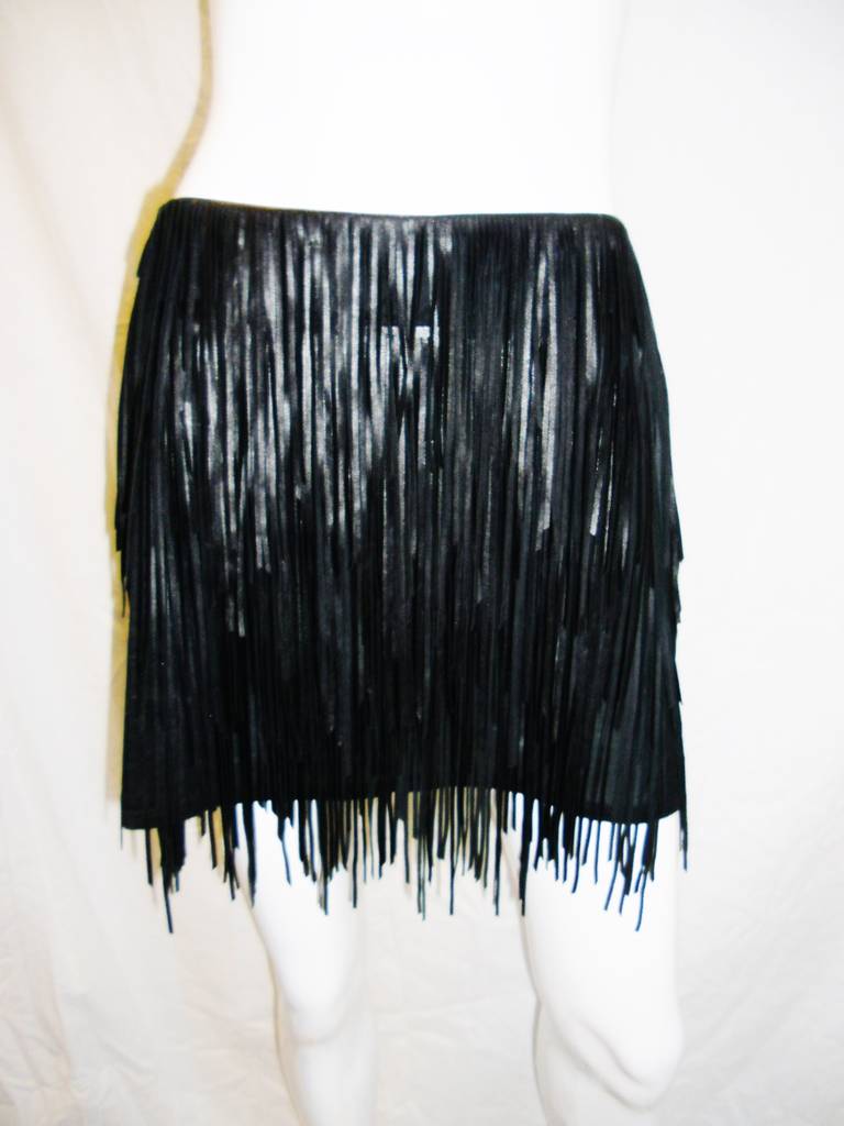 Fabulous lamb skin fringed skirt by  Jean Claude Jitoris.  Designer that created various outfits worn by Lady Gaga. Three layer of most supple and soft  superb quality leather on silk. New.The fringe is balanced perfectly with the sheer and  is just