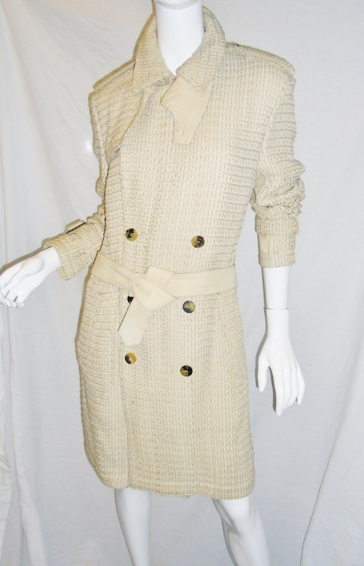 Incredible piece. Only 3 made by order. All hand woven with thin lamb suede trips and cotton thread. Natural horn buttons and sleeve belt buckles. Show stopping trench coat in excellent condition. Worn once on runway and used  few time for photo
