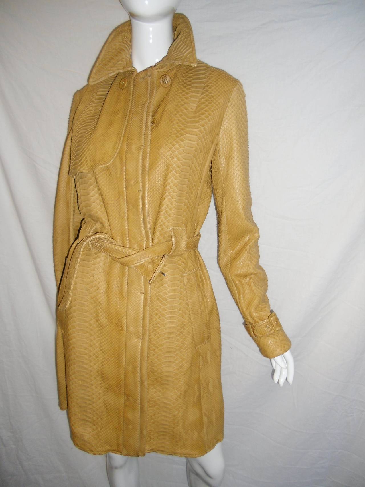 Famous Italian  house for exotic skin Borbonese Python Trench Coat Jacket and skirt ensemble . Breathtaking ! Superb craftsmanship. Every detail is perfect!! Full skins. Set is new never worn. Size 4o us 4. Retail price was in tens of thousends
Made