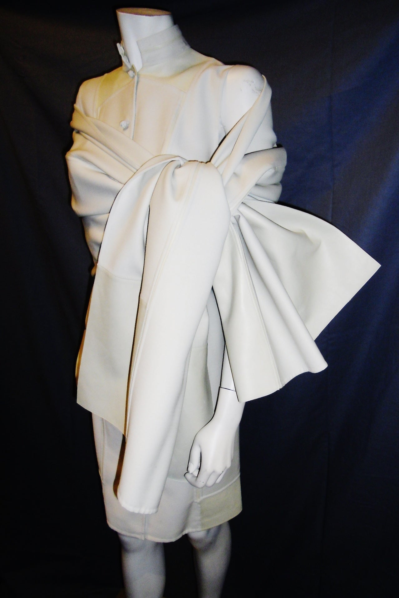 $6400 tag beautiful last of Ralph Rucci winter white/ creme wool dress with lamb leather inlay. French knots front closure.  Additional huge wool shawl with leather. Stunning statement outfit.
Size 10.
Please refer to measurements :
Bust: 40