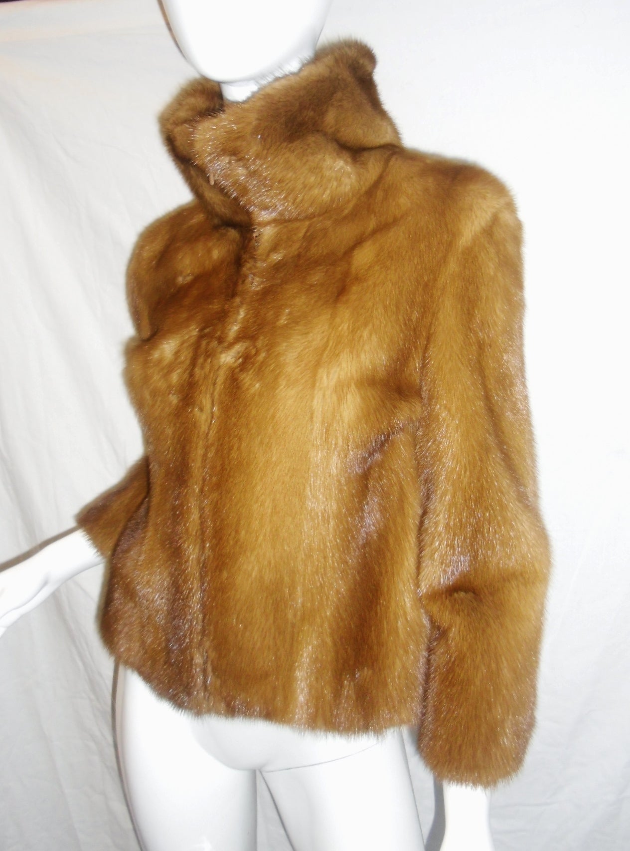 Beautiful and in mint condition Dolce & Gabbana Cognac Mink Fur Jacket Coat Leopard Lining. All female skins. Weight next to nothing. . Features high collar and concealed front zip closure. Size 38 Italian Us 2-4
Bust 34