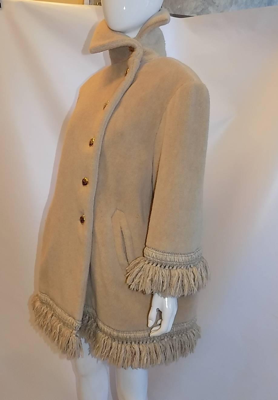 Beautiful cafe au lait  color wool coat by Valentino. Resembling sheared fur with hand crochet fringed trim.  Side button closure with fabulous turtle buttons. High collar, wide sleeves, side pockets. Fully lined. Pristine condition like new.