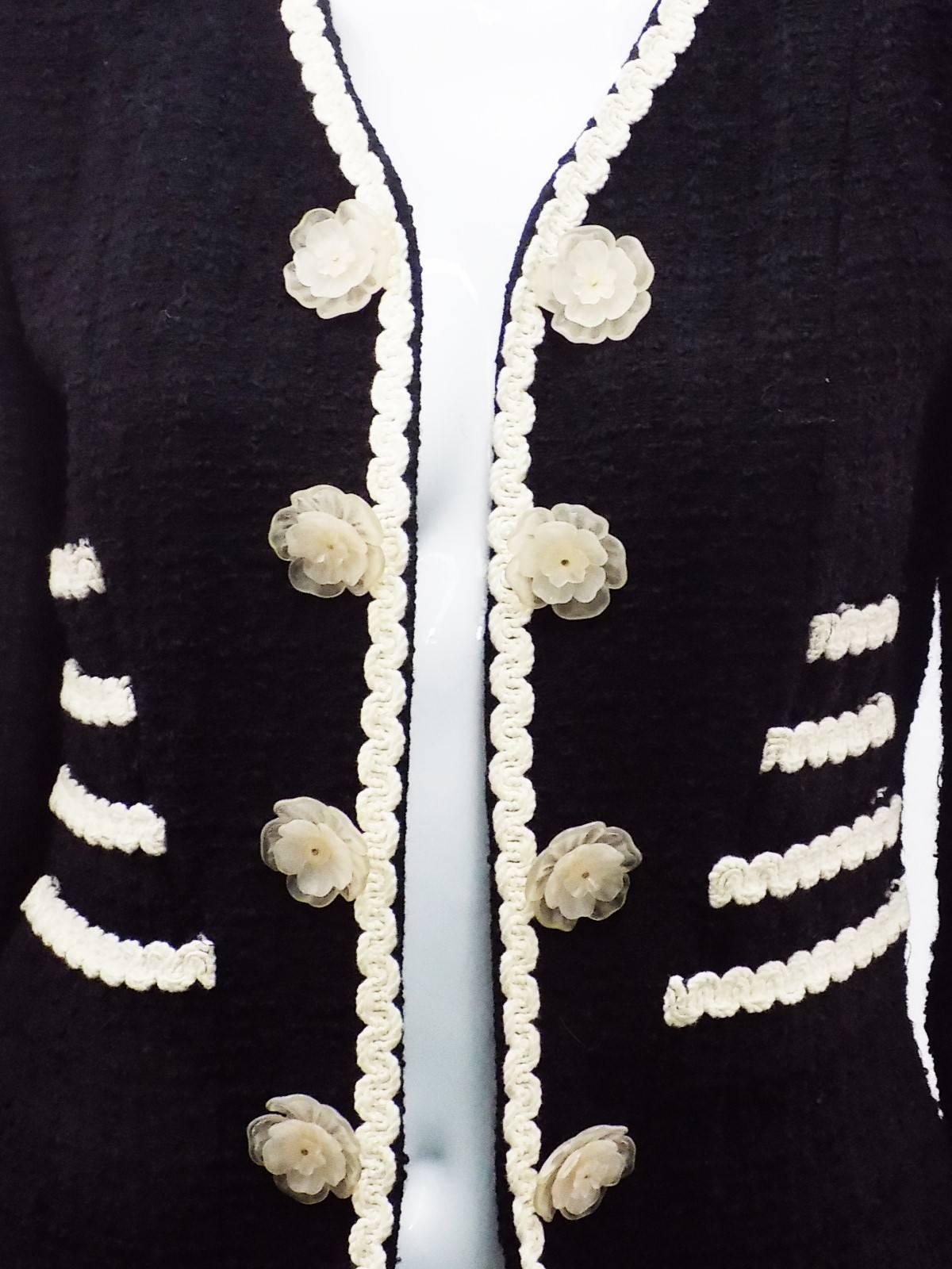 Let them eat cake! This Chanel-style Cheap and Chic jacket features the most adorable cake layers as pockets and clear large moving  floral buttons. Black buckle with white trim. Fully lined. open front. Size stated 10but very small . please refer