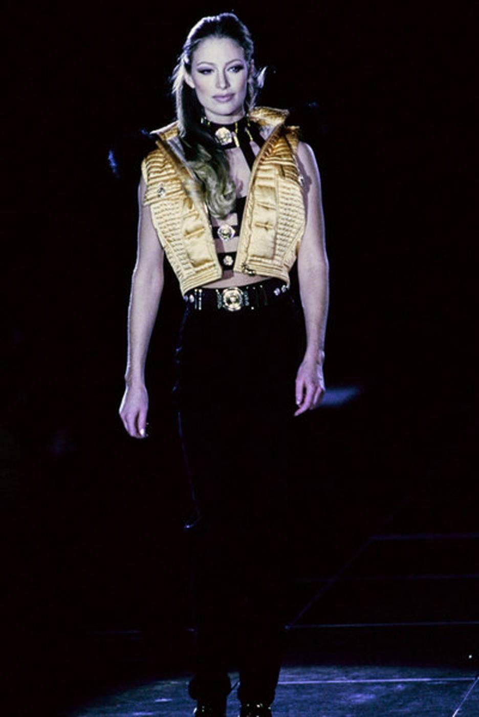 Gianni Versace's Fall 1992 collection, provocatively titled Miss S&M, ... Linda Evangelista wears this same satin puffer vest on the catwalk in yellow..
Vogue reports…

“Gianni Versace’s Fall 1992 collection, provocatively titled Miss S&M, had
