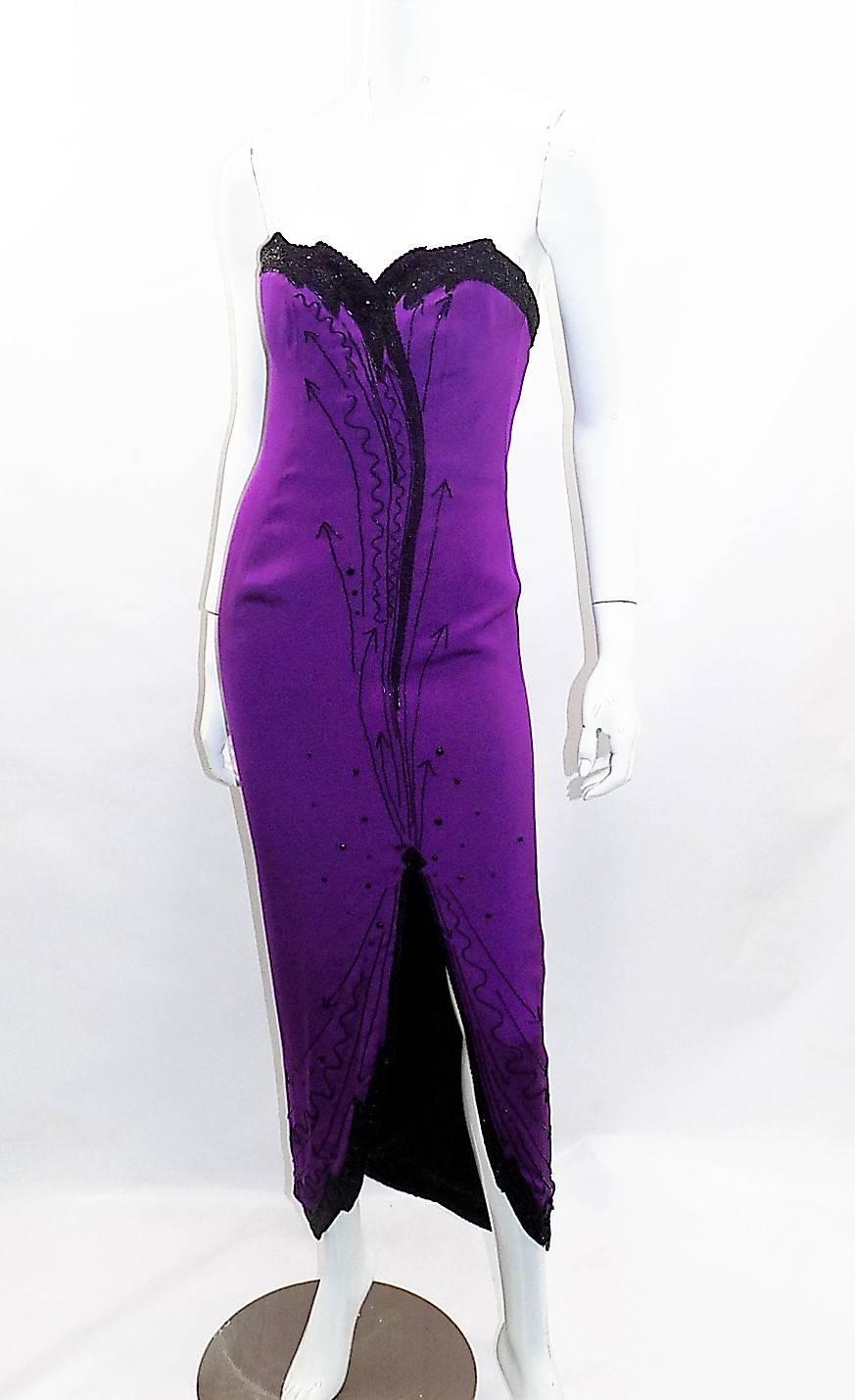 Circa 1980 In Pristine condition Never worn Fabulous Fabrice Gown.  Fully Boned Corset Strapless  Dress. Dark purple color with black  beading. Every bead is intact!! Look Glamorous!! Size Small
Bust 32"-34" Waist 26" Length taken at