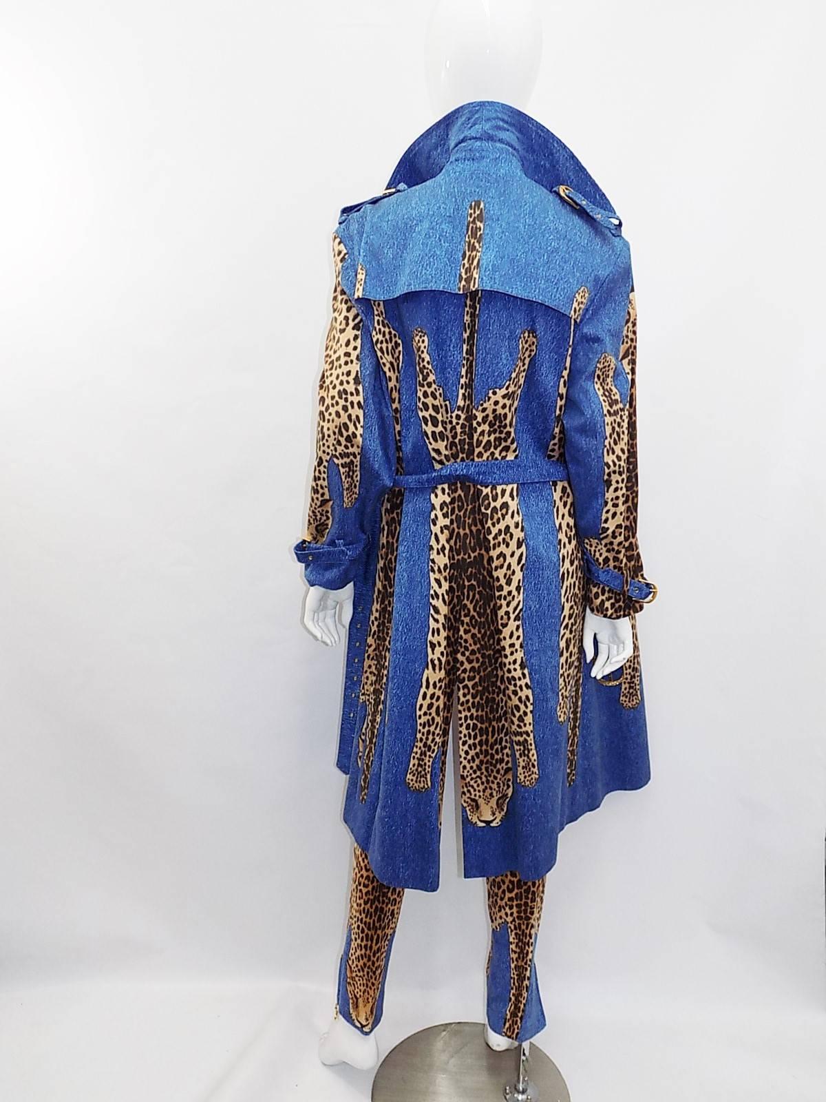 Only John Galliano could come up with outgregious and spectacular designs like this!! From Famous collection 1999 here comes trench coat, Blue jeans with full leopard skins printed . Large C D logos in brass as  buttons. Skiiny leg pants/ jeans with