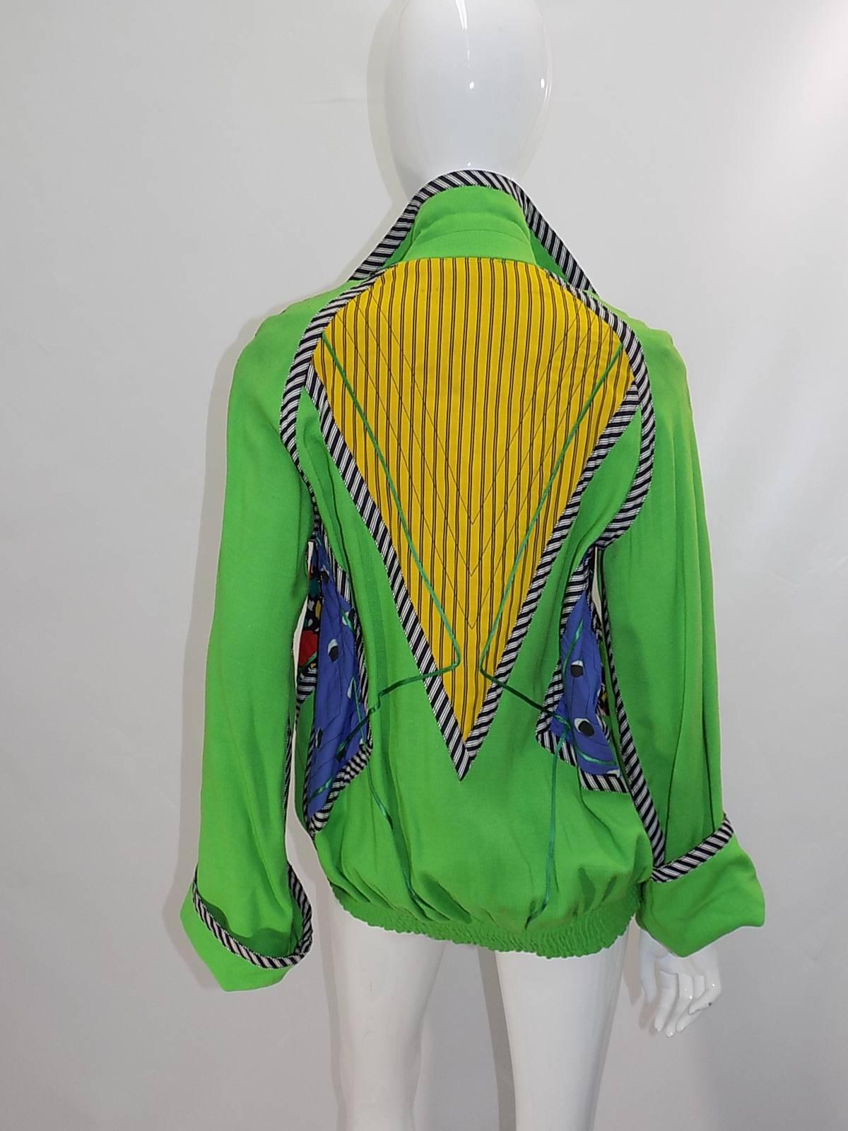 Never seen and in pristine condition!! Vibrant green color. Color block pattern patchwork design. Wide cuffed sleeves, elastic waist and zip front closure. Pristine condition!! Will fit sizes 4-6
