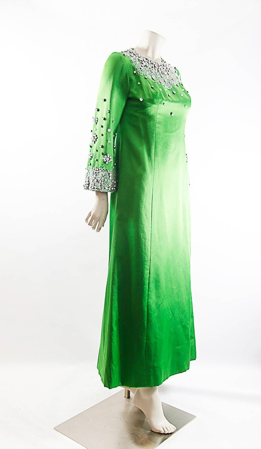 Stunning Noln Miller green  Gown . Pristine Condition. Apple green color frosted with hand sewn crystals and embelished with caviar beads. . Circa 1960.Pure masterpiece. Size 4 with bust 34