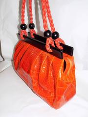 Luxury Suarez Alligator  bag with ebony frame . New!