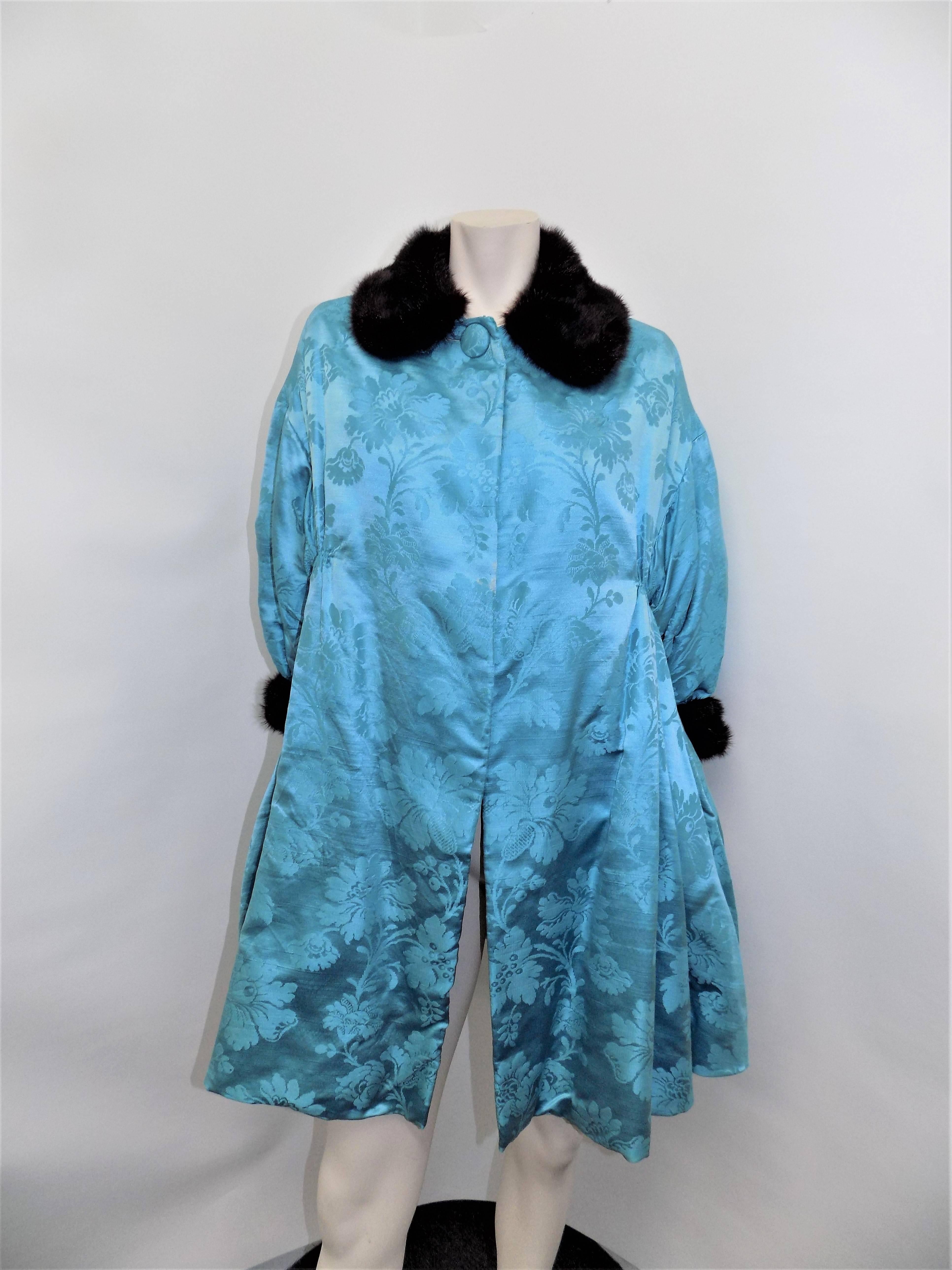 Spectacular late 1950's  silk turquoise blue brocade coat by Jeanne Lanvin house. Designed by than very talented  Antonio Castillo. 
Castillo, together with Pierre Balmain, Cristóbal Balenciaga, and Christian Dior, was considered one of the most