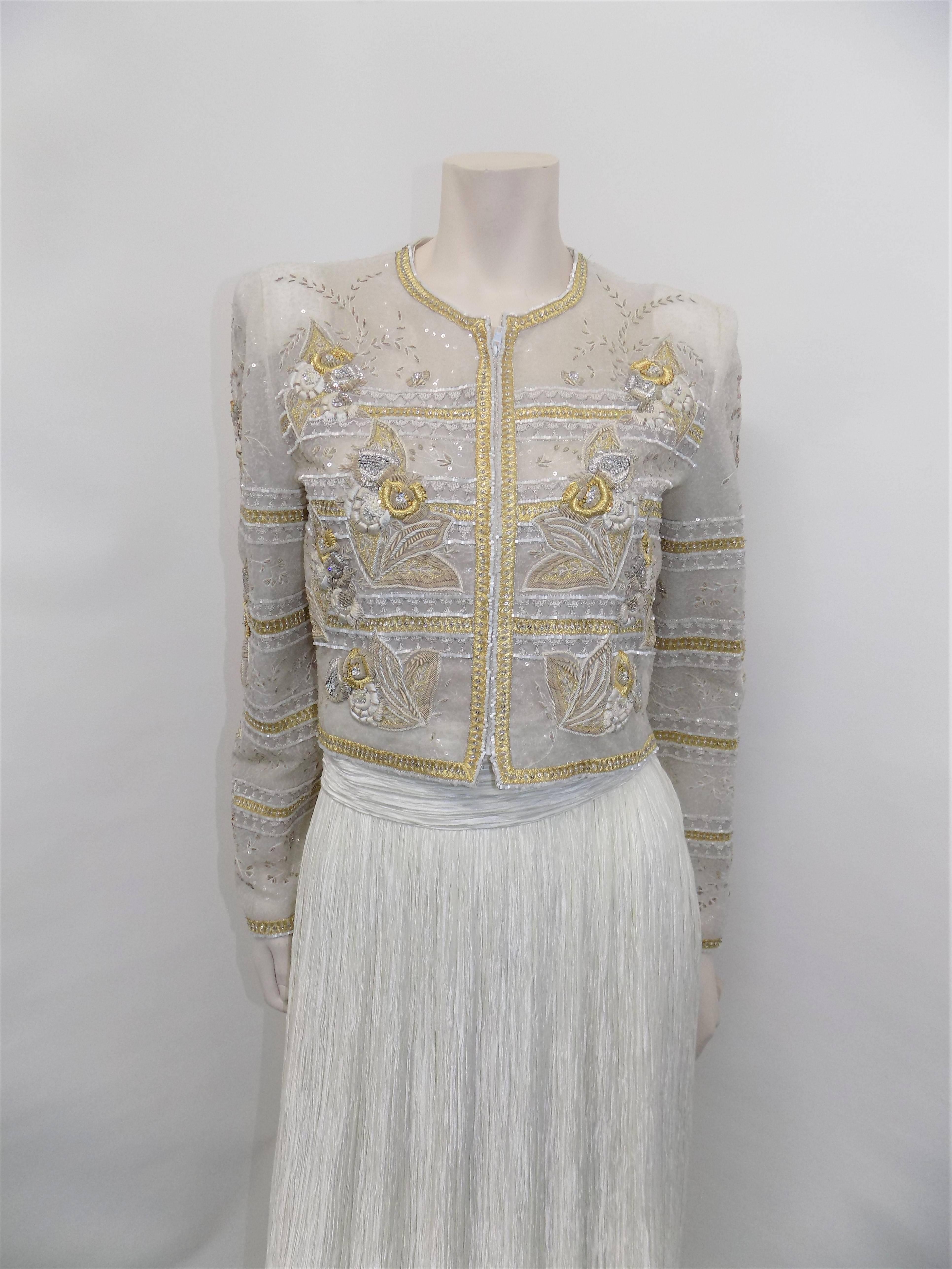 white, gold and silver Mary McFadden Couture Bolero beaded jacket with pleated skirt. Beautiful work on jacket. True art. Skirt is straight with wide belt.  Size 10. Pristine Condition.  Both pieces could easily be won separately. Bolero jacket