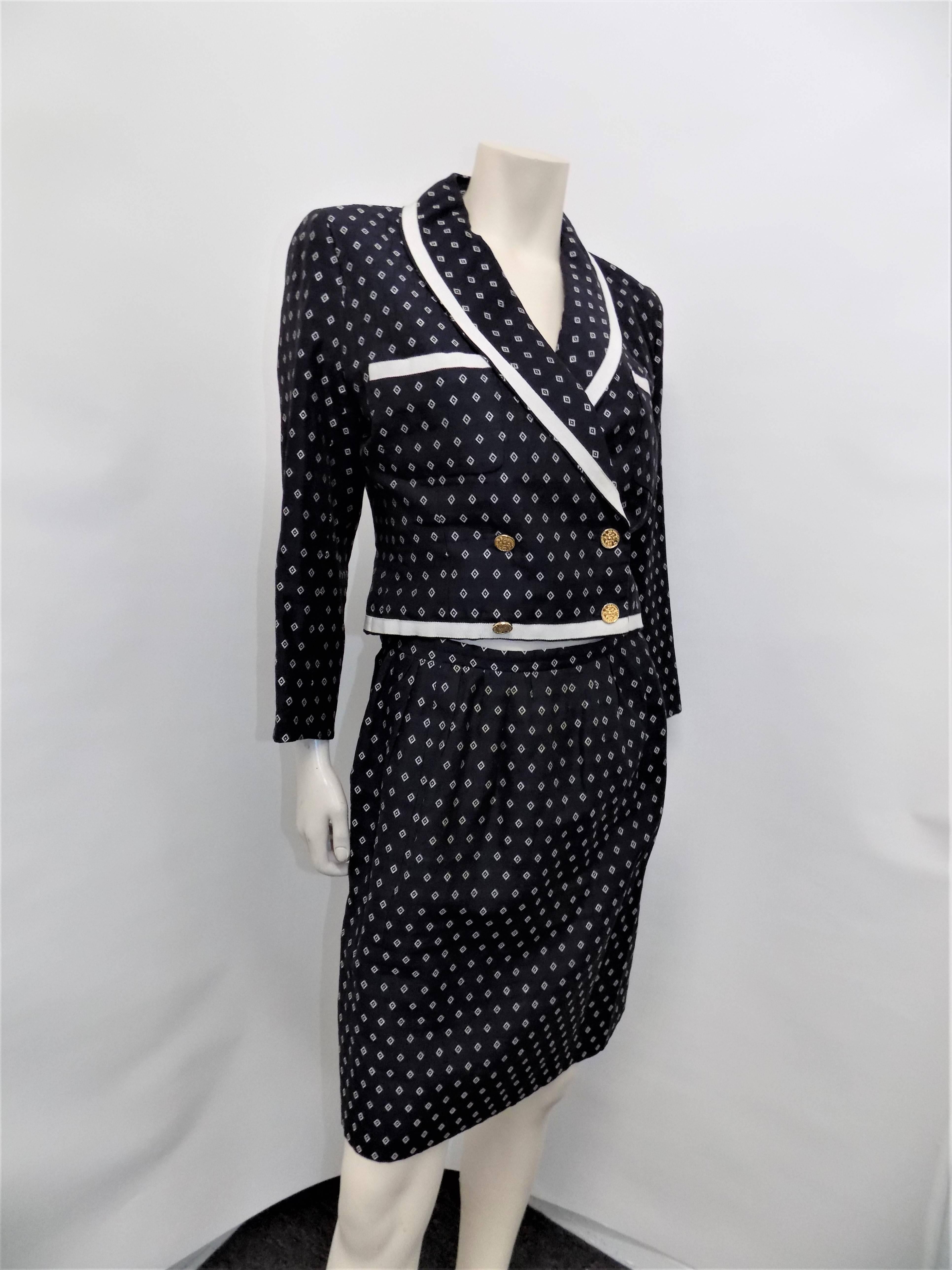 Still great  silk 2 pc Chanel skirt suit. Navy and white print silk with grosgrain trim.  Shawl collar . cropped yule jacket double breasted with four large Coco Chanel buttons.  Suit is very retro but it could be worn separately   with pants and t