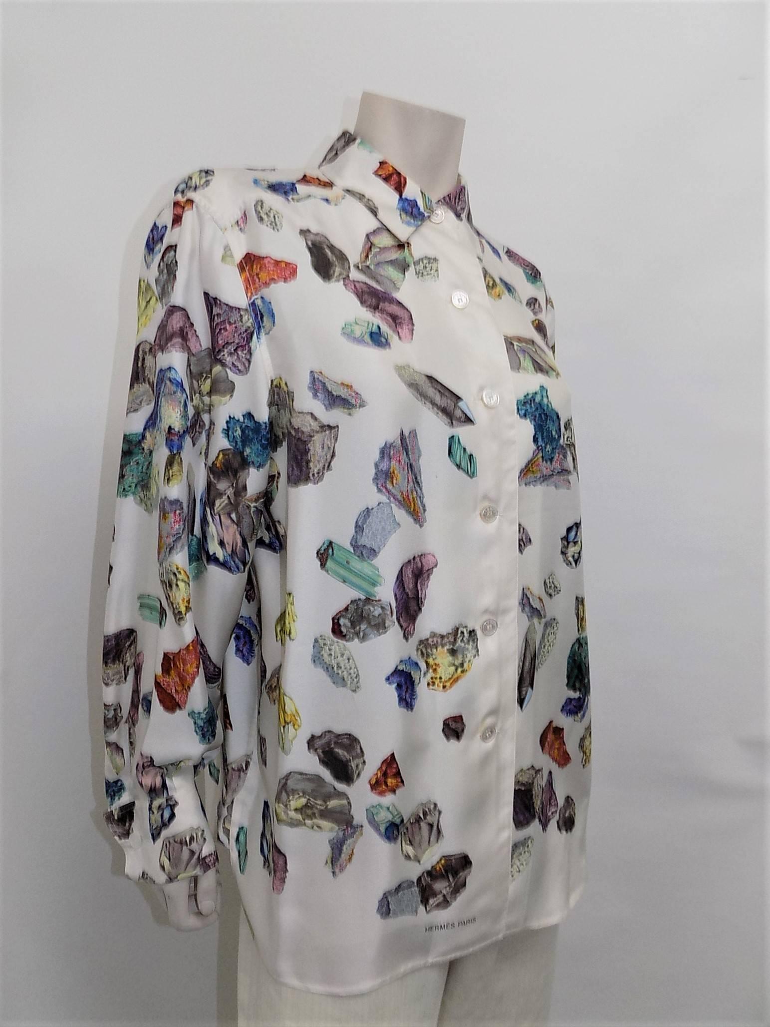 Gorgeous and rare vintage Hermes blouse with mineral print. Double cuffed with mother of peal buttons featuring Hermes logo. 
Pristine condition.
Size 40.
Measurements:
Bust 44