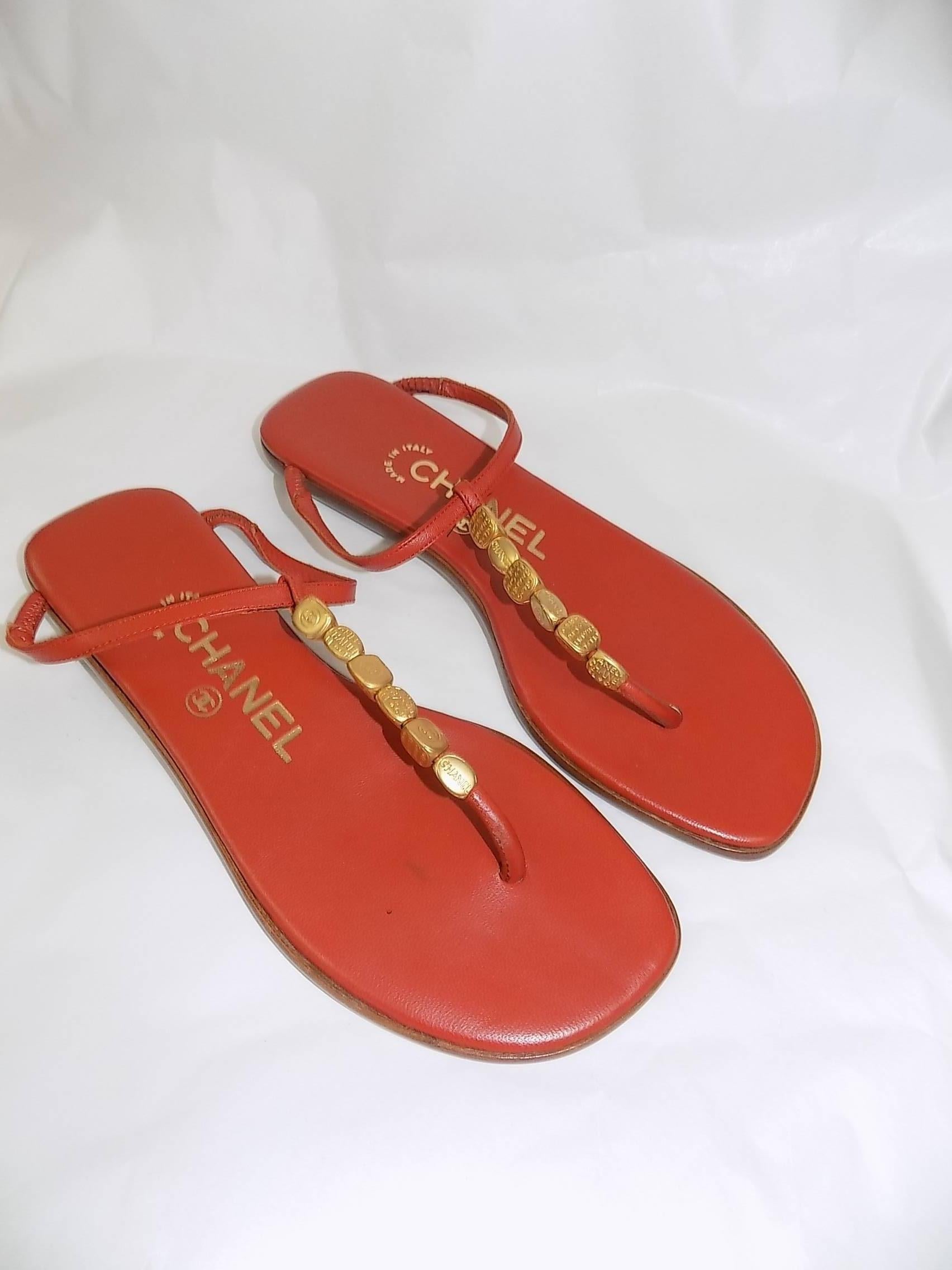 Orange Red leather Chanel thong sandals with gold-tone logo bead embellishments 35