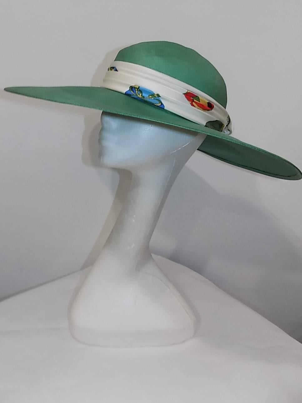 Truly One of a kind Fabulous Hermes summer Hat. 100% silk  . Incredible millinery. Large brim and Hermes scarf folded as a detail. Pristine condition. Like new.  Sized 57