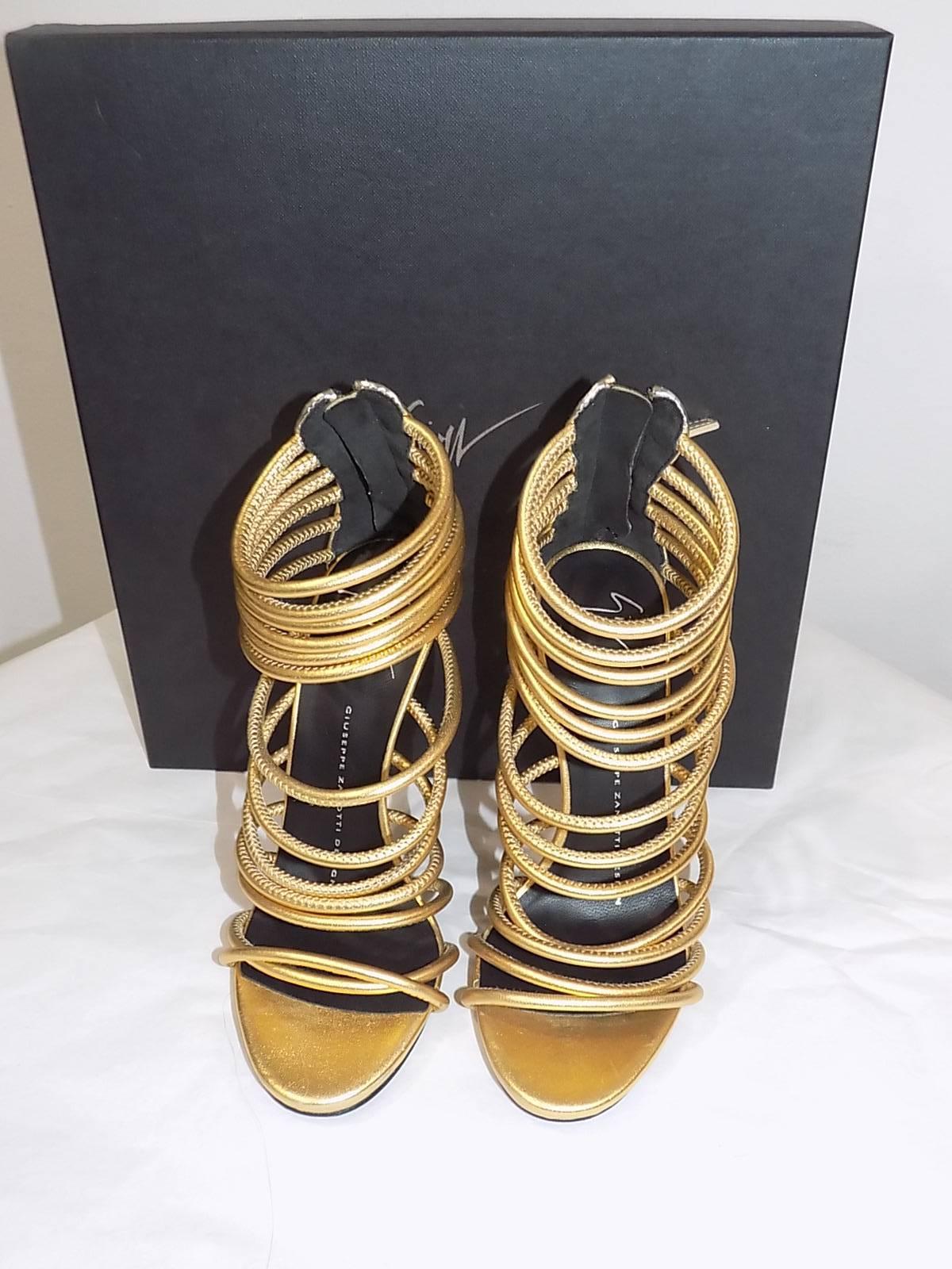  New in box Giuseppe Zanotti Metallic Gold Strappy  Bangle Sandal , Gold  with silver detail at the back and zipper. Size 5