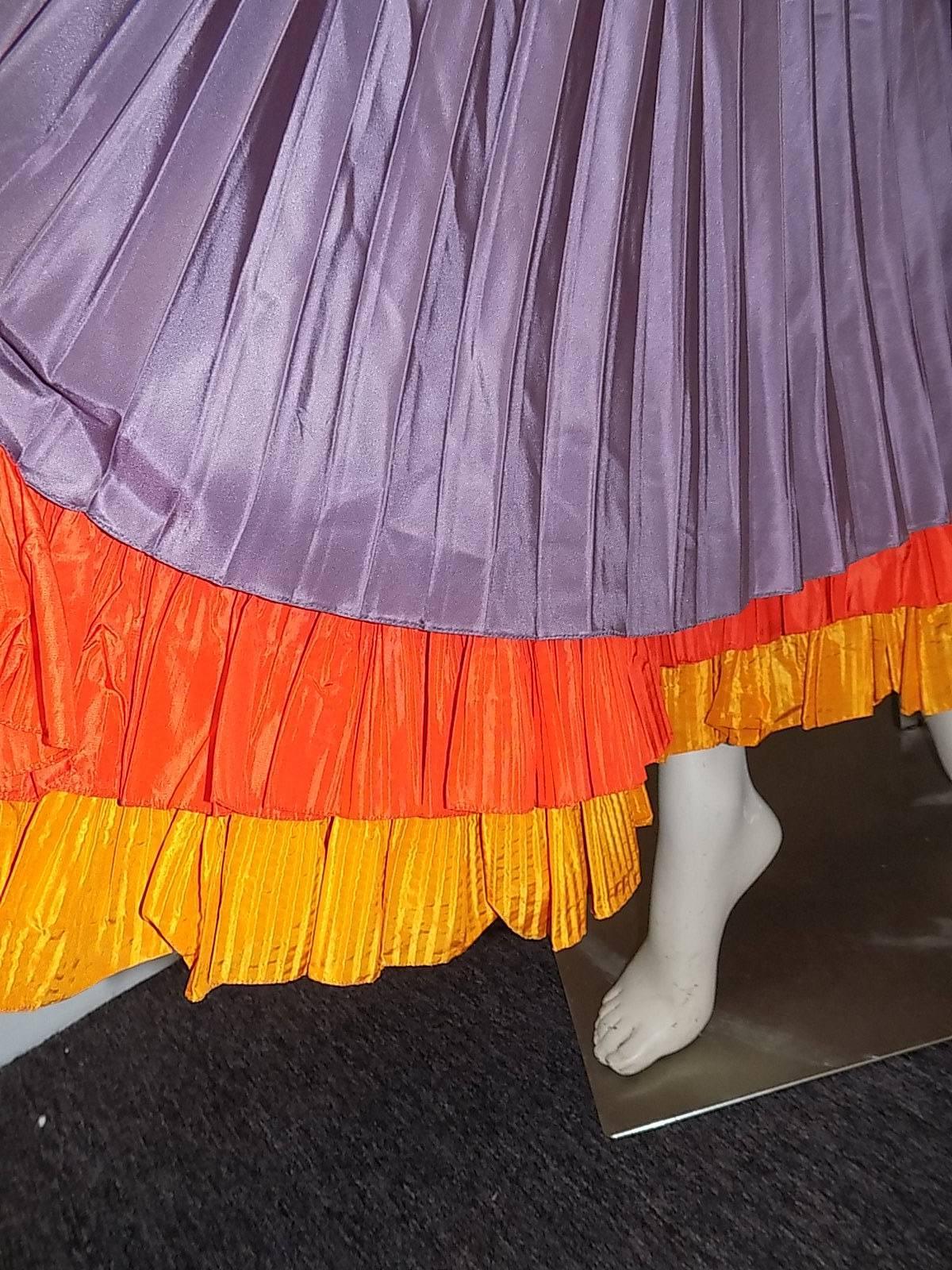 Super spectacular vintage Oscar  de la Renta   long  pleated  skirt with embroidered belt.   Silk taffeta  in lilac color  featuring two cascading yellow and orange layers of ruffles. Spanish   influence in design. Yellow embroidered wide belt with