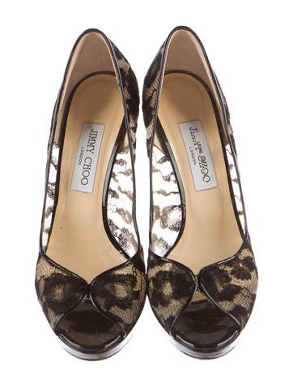 Black lace Jimmy Choo Belgio peep-toe platform pumps with tonal stitching throughout, patent leather trim and covered heels. Includes  original Box and sleeping bags. Worn once in pristine condition. Retail $885