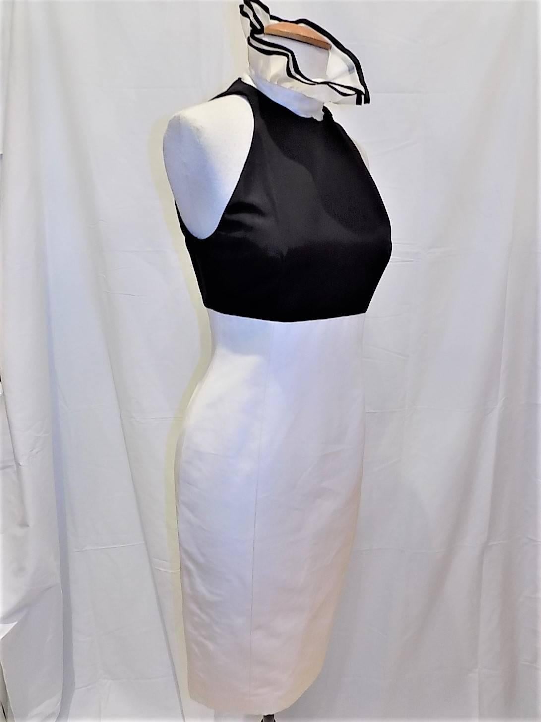 New with tags beautiful crisp  cotton  and silk crepe Ralph Lauren Collection black and white sheath dress with removable  silk organza  ruffled collar. Fully lined in silk. New with tags. Beautiful oposite collor covered button closure at the back.