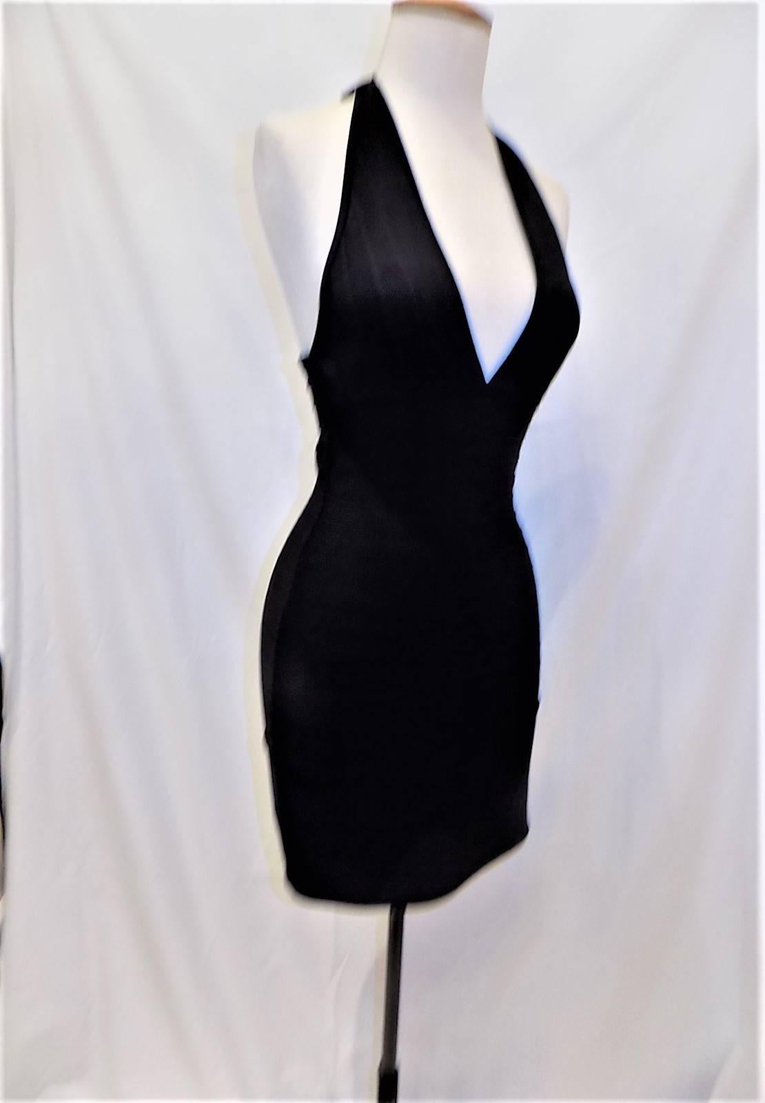 Once so fabulously made Herve Leger original black halter bandage dress with tags . Perfect seems and fabric. Tie at the neck. New never worn.  size Small
Retail Price at that time $750