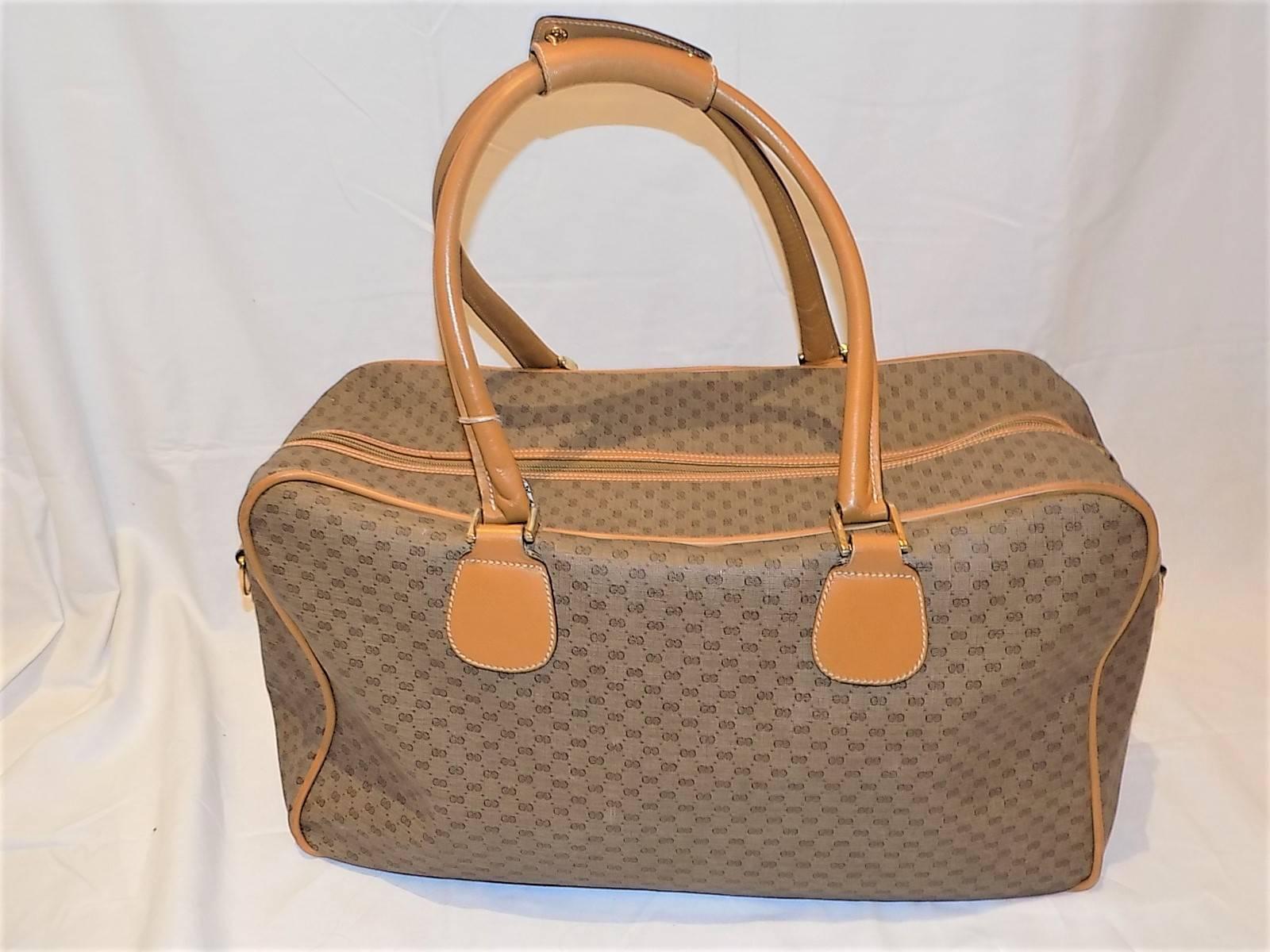 Gucci Vintage Authentic micro gg pattern logo hand travel bag. PVC with  Leather Trim, two long rounded leather shoulder strap , gold toned hatware. Pristine condition.
20