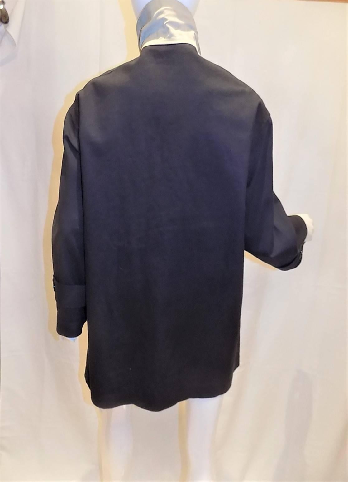 Extremely rare to find Hermes cotton rubber treated rain jacket. Large bone made front buttons engraved Hermes . Underarm vents. Silk lined back and under collar. Two  side pockets. Pristine condition. No signs of any wear. Size 4-6