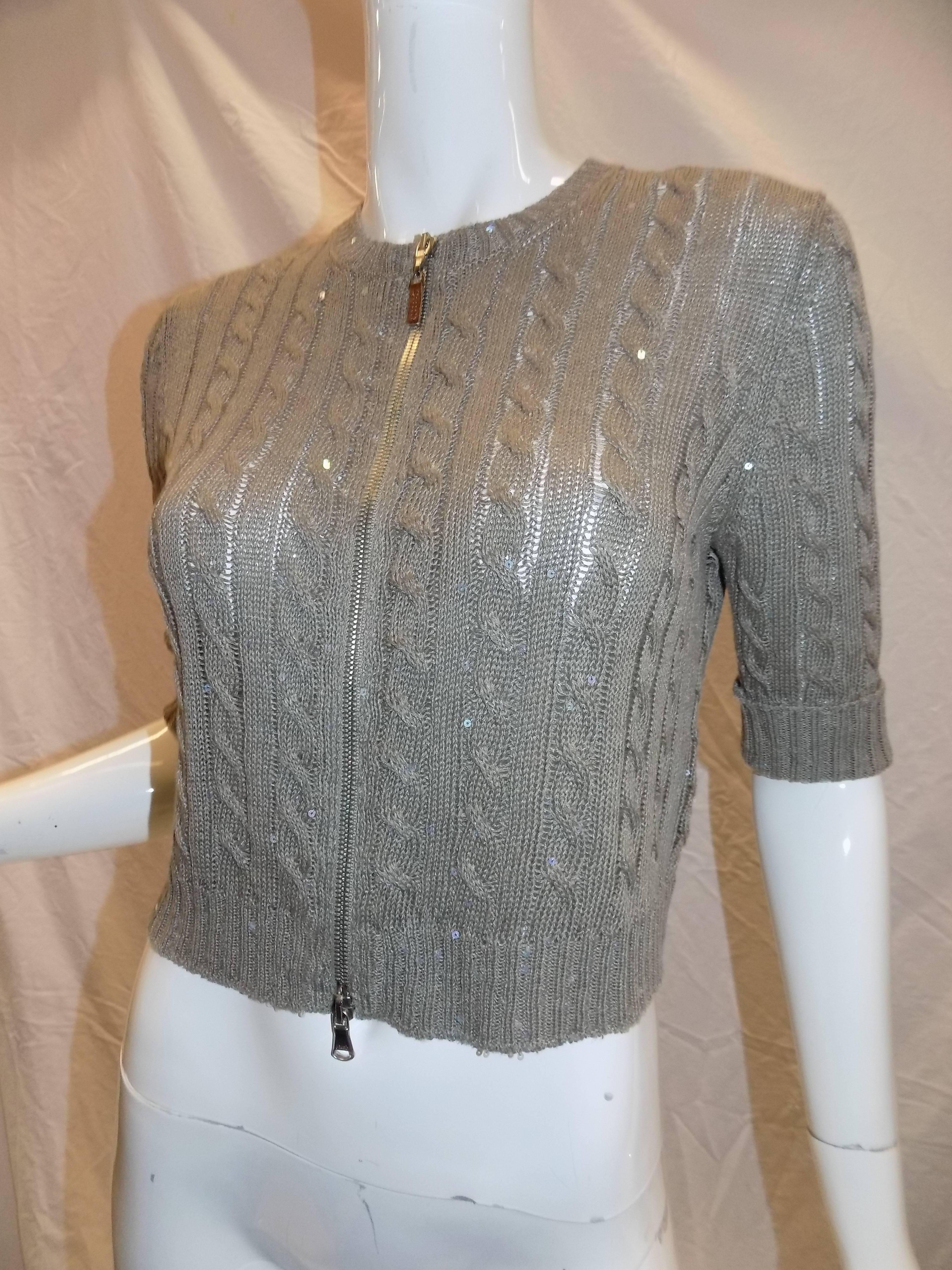 The sequins add sparkle for that dramatic look. Beautiful medium/light weight knit sweater. Linen and silk blend in tan, taupe. cable and ribbed pattern. 63% linen, 21% silk, 16% cotton. Full front silver zipper with leather pull. Round neck with