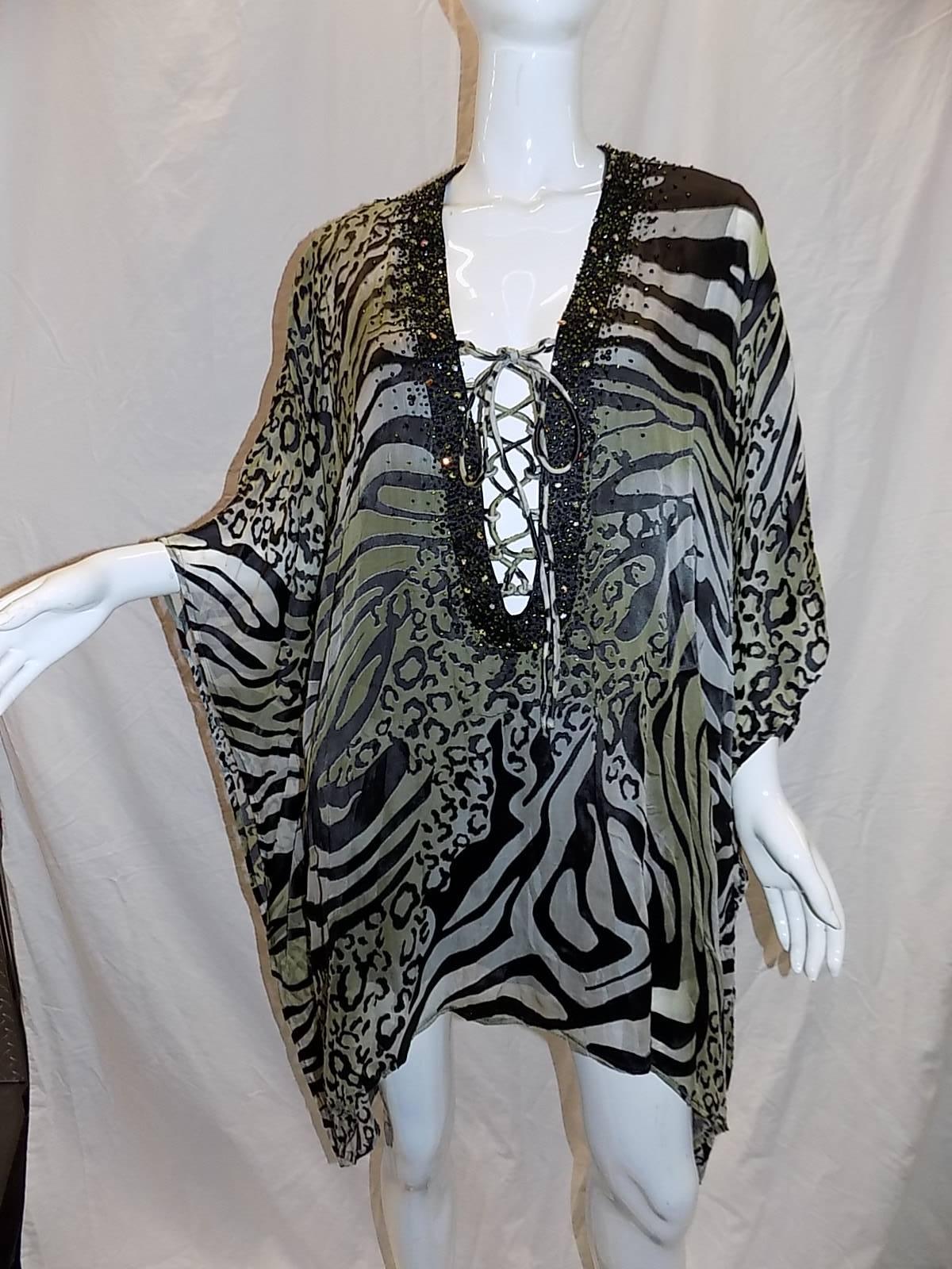 Spectacular Camilla laser cut silk caftan  featuring  lace up  beaded neckline  and high low hemline. Never worn . OS . bust 48" 